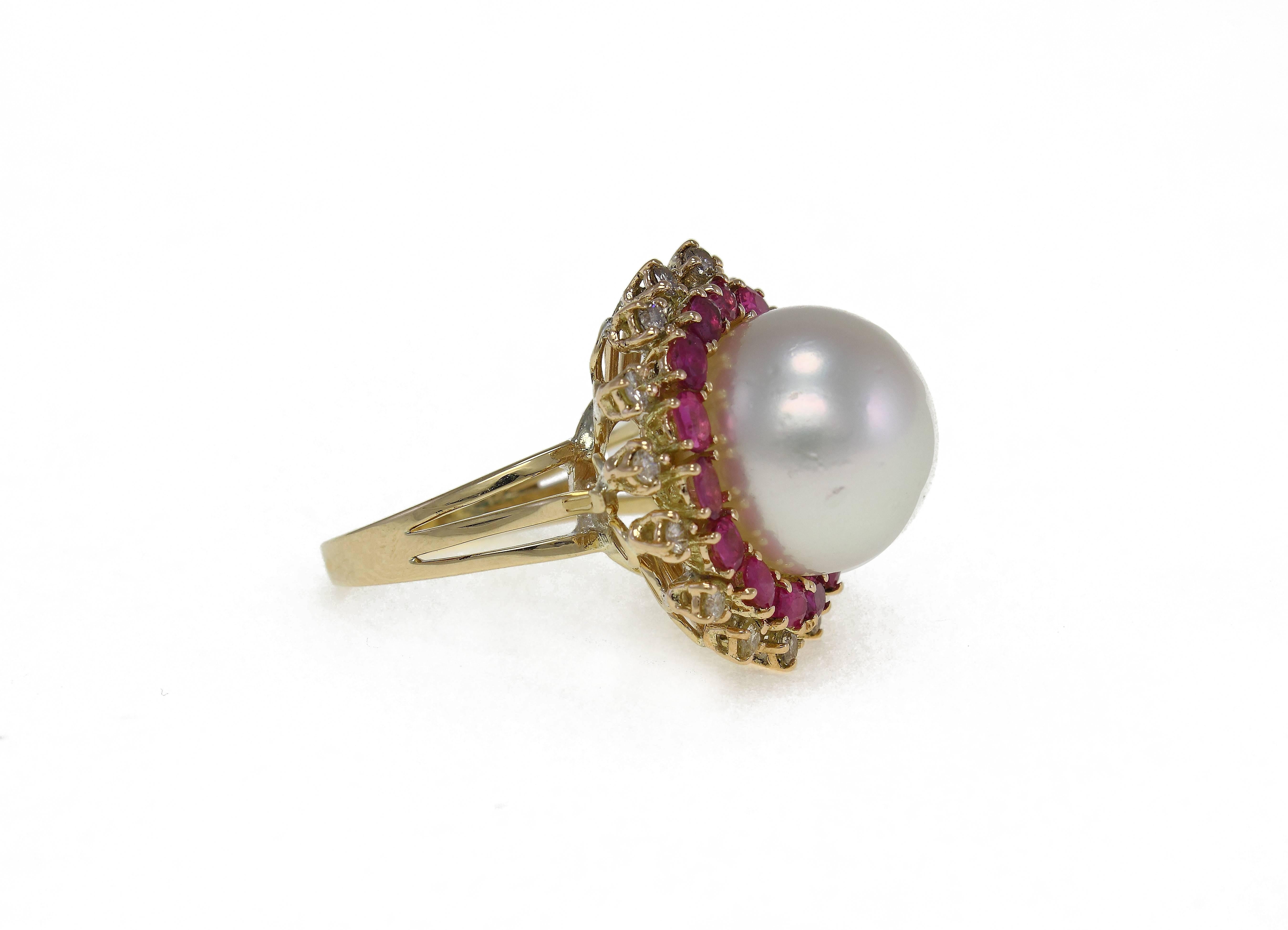 Graceful ring in 14Kt gold composed of a central pearl surrounded by a crown od rubies and diamonds.

diamonds (0.56 kt) 
rubies (2.09 kt)p
earl diameter of 14.5 mm
tot weight 12.4gr
US Size
Width 0.90 inch
Length 0.90 inch
Higth (worn) 0.59