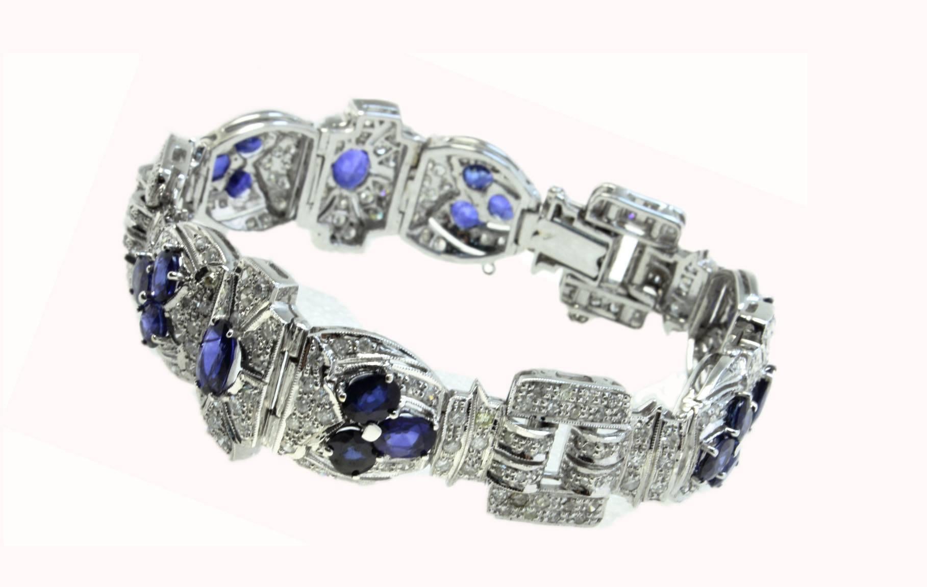 Charming choosing of colors for this retro bracelet composed of shiny diamonds and embellished with drops of blue sapphires. All is mounted in 18 Kt white gold.
Tot weight 36.3 g
Diamonds 5.42 ct
Blue sapphires 10.52 ct
Rf. gugef

For any enquires,