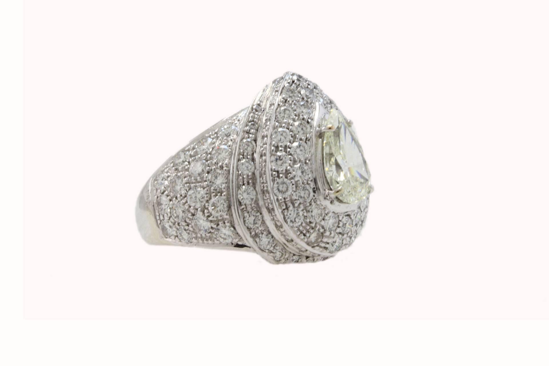 SHIPPING POLICY:
No additional costs will be added to this order.
Shipping costs will be totally covered by the seller (customs duties included).

Extraordinary fashion ring entirely composed of 2 domes of diamonds, on top of them a single drop of