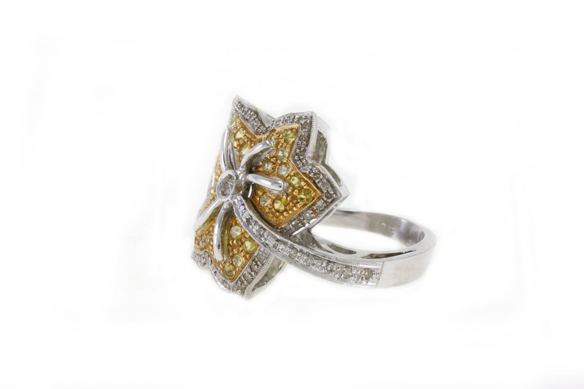 Shiny leaf shaped ring in 14kt yellow and white gold coveder in diamonds and topazes. 

diamonds 0.53kt
topazes 1.08kt
tot weight 14.0gr
US Size
Width 1.15 inches
Lenght 0.99 inches
Diameter 0.74 inches
ref,gera
