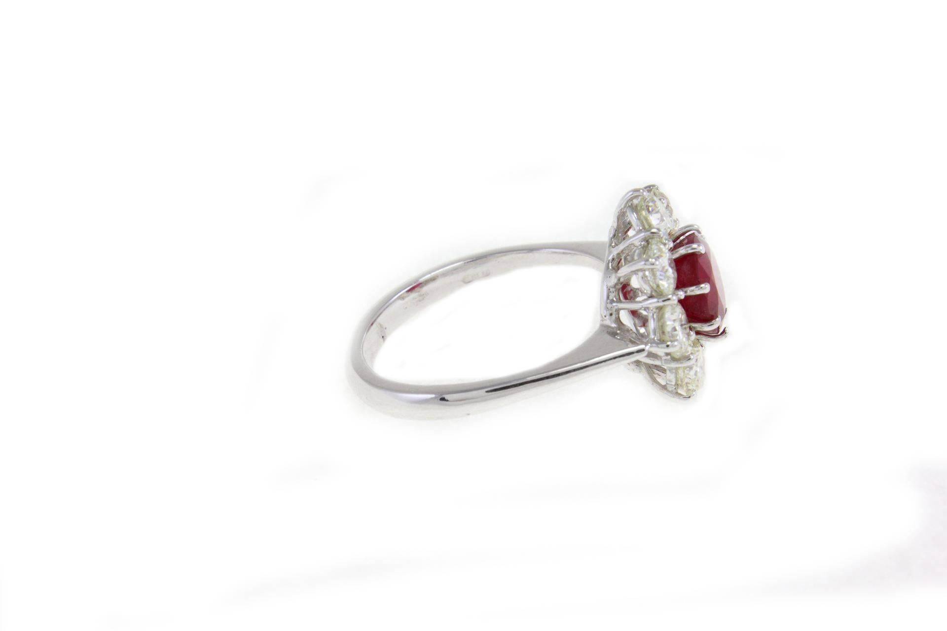 Splendid design for this exquisite 14Kt white gold (3.75gr), the icy color of the brilliant cut diamonds (2.02 Kt) are a perfect frame that enhance the ruby's red color(2.20Kt).
Rf.159951
US Size
Width 0.59 inch
Length 1.06 inch
Heigth(worn)