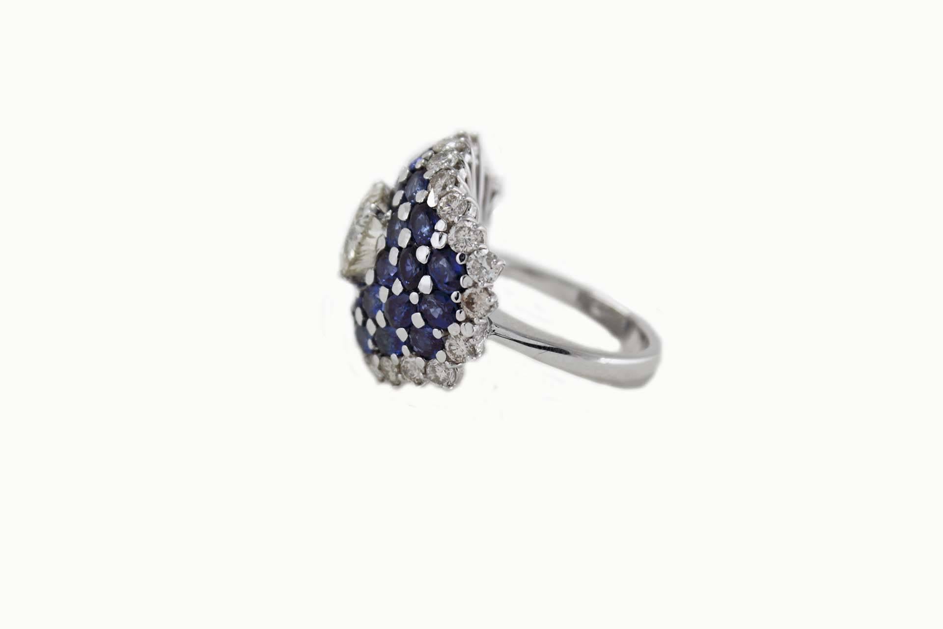 Magnificent ring in 18Kt white gold covered in diamonds and blue sapphire that surround a cut diamond
diamonds (2.23Kt), 
blue sapphire (6.01 Kt) 
cut diamond (2.1 Kt). 
tot weight 15.6 gr
Rf. 5249057

For any enquires, please contact the seller
