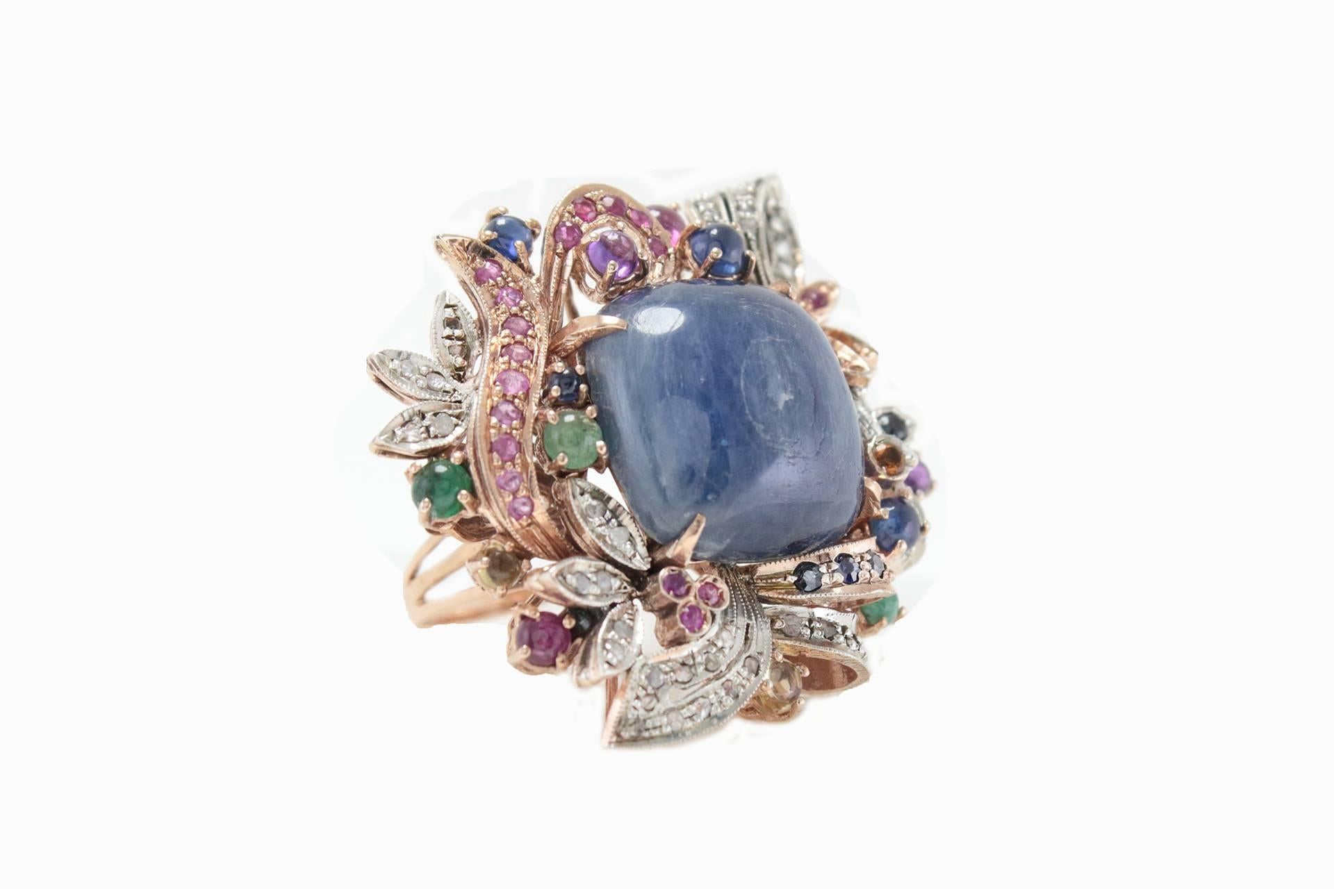 Charming ring in 9Kt gold and silver composed of a central lovely square shaped Cianite or Kyanite surrounde by diamonds, multistone sapphire, emerald and rubies.

multistone sapphire, emerald and rubies(tot weight 3.90Kt), s
Cianite or Kyanite