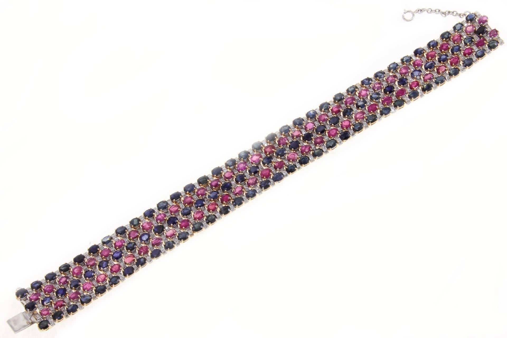 Luise signed bracelet in 14kt yellow and white gold covered in sapphires rubies and diamonds.

diamond(2.36 kt )
sapphires and rubies (30,29 kt) 
total weight 40 gr 
length  1,7cm 
width 18.5 cm
ref 6111432