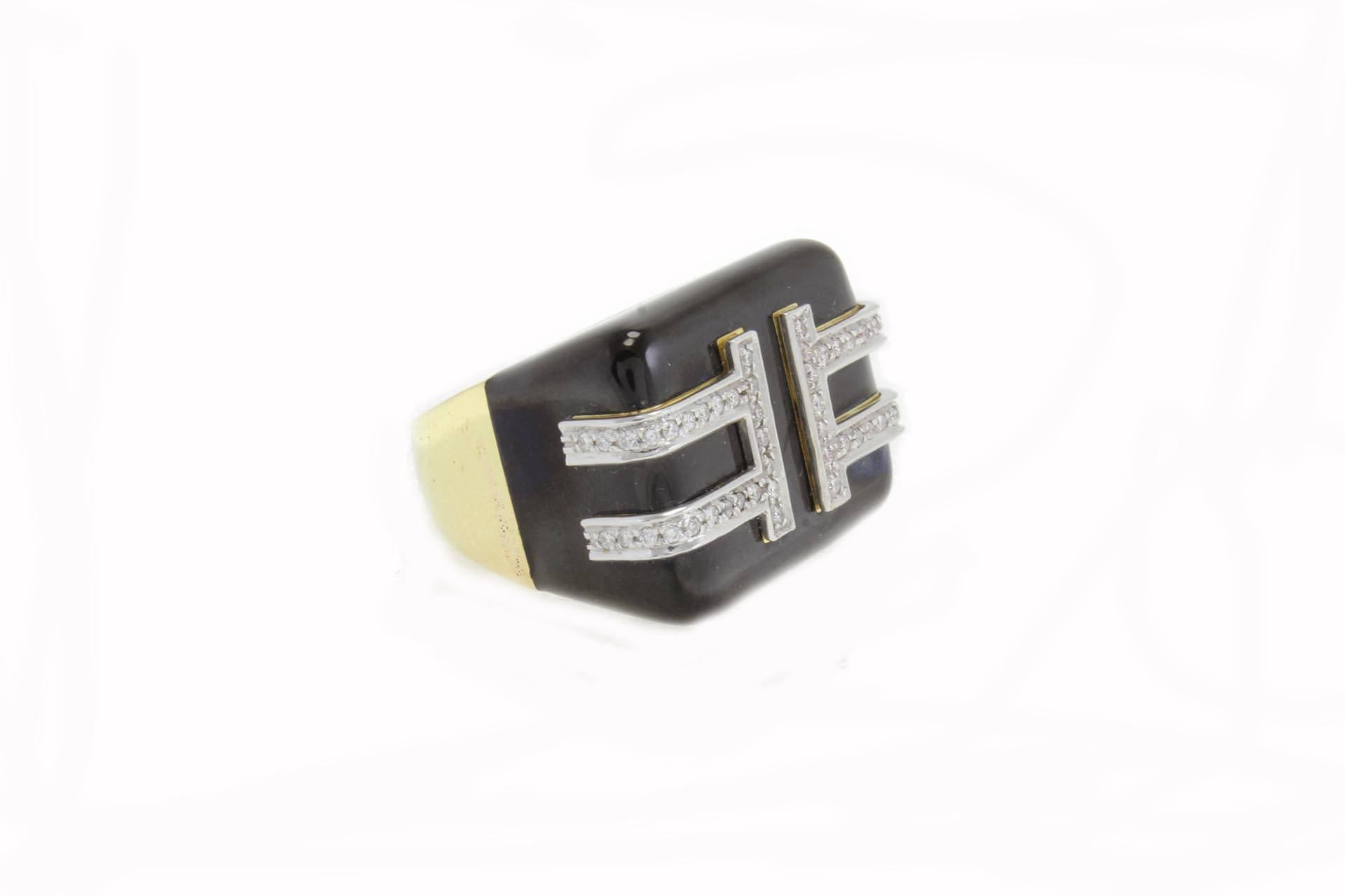 Fashion ring in 18 kt yellow gold and platinum embellished with enamel covered in diamonds lines.
diamonds (0.52 kt) 
enamel (2.50 gr).
tot. weight  26.9 gr
r.f 2130719 
Italian Size 14
French size 54
Usa Size 6.84
Ring Dimentions: 29 mm X 20 mm