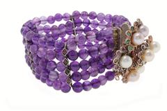 Bracelet en or et argent orné de pierres précieuses et de perles