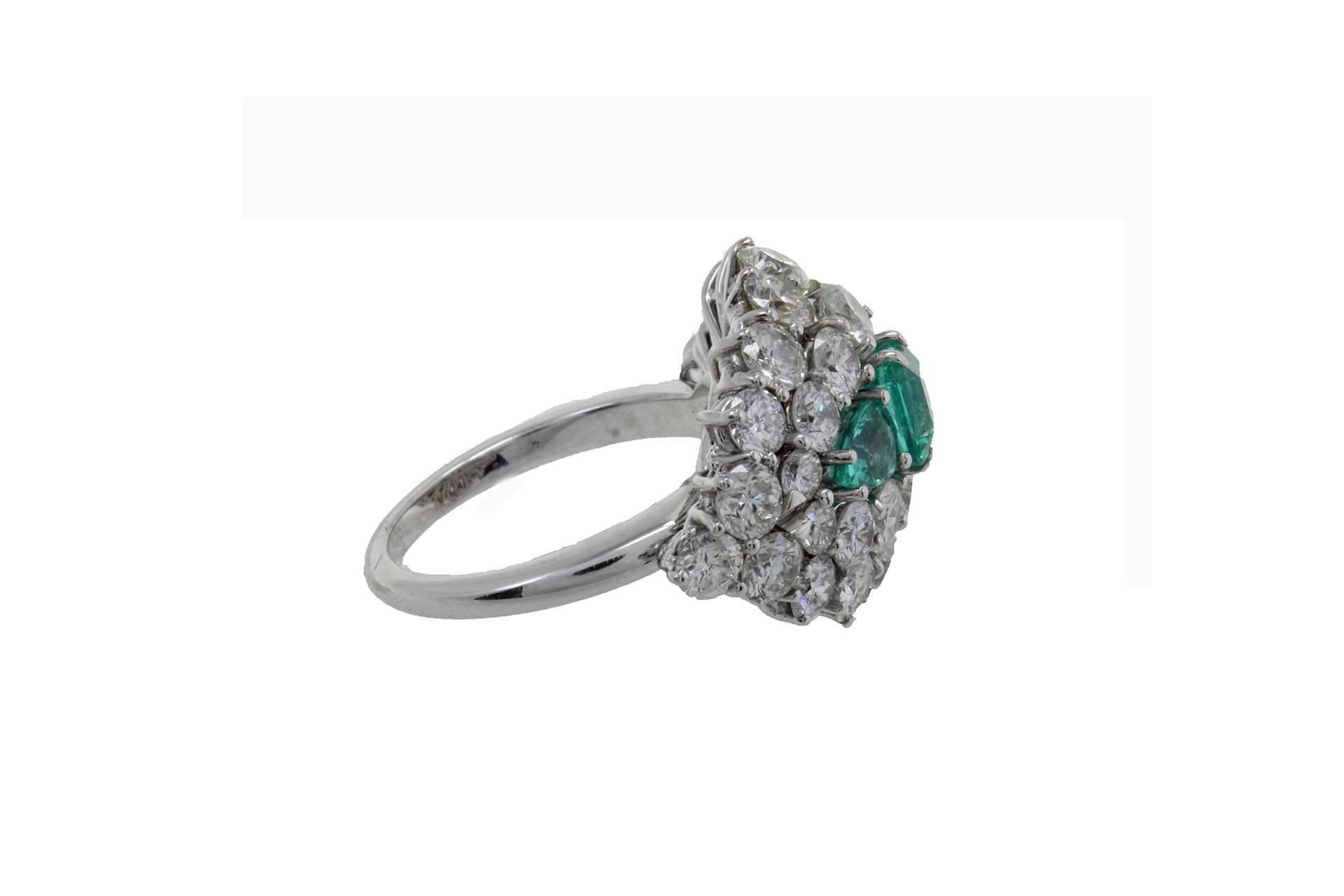 shipping policy: 
No additional costs will be added to this order.
Shipping costs will be totally covered by the seller (customs duties included). 

Charming dome ring in 14Kt white gold composed of a trilogy of emeralds surrounded by