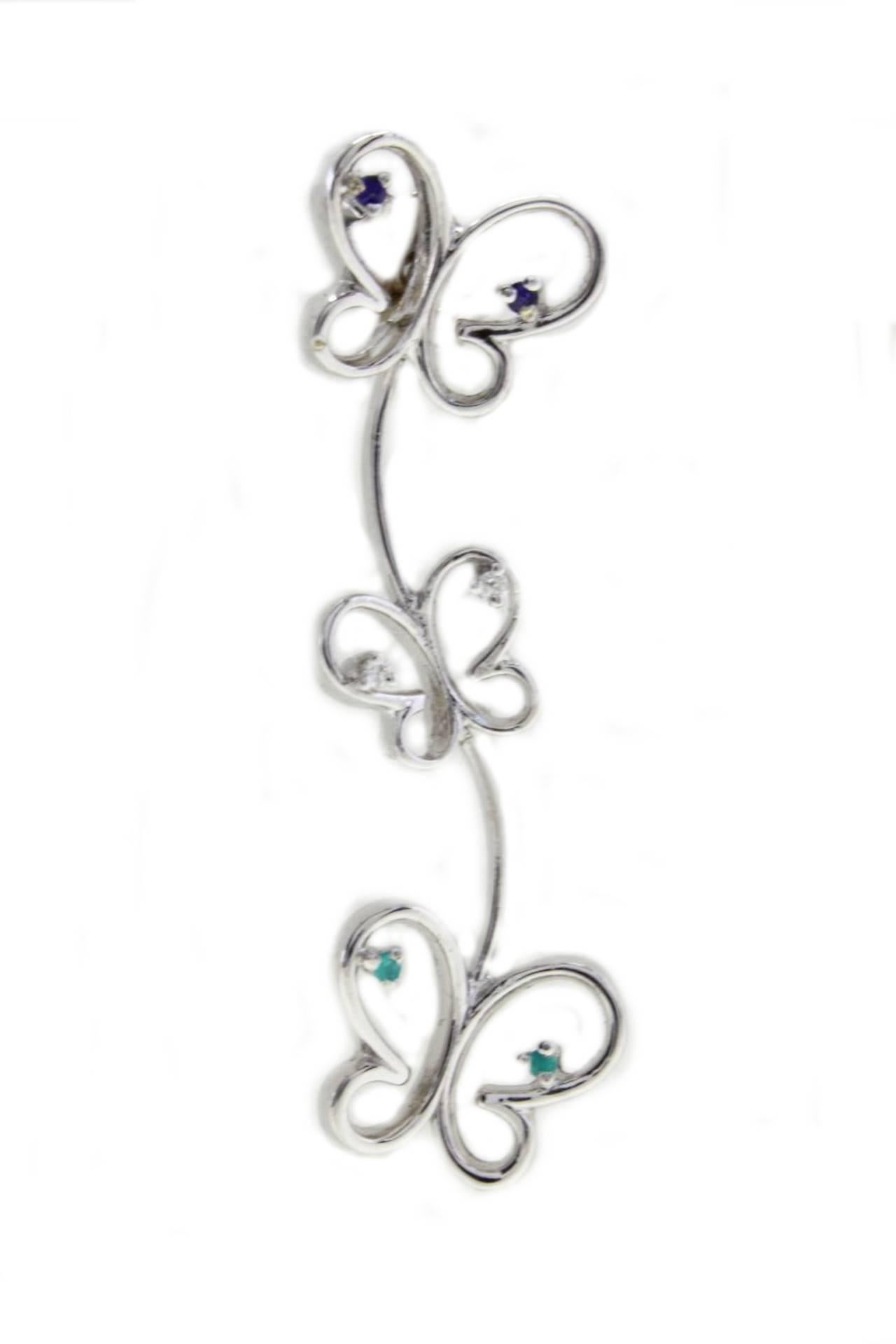 Elegant 3 butterflies earrings in 18Kt white gold with little shiny emeralds and blue sapphires and diamonds on the wings.  
emeralds and blue sapphires (0.05Kt) 
diamonds (0.03Kt)
Tot weight 4.9gr
RF   G  UUGR
RK.AGUI92

For any inquiries,please