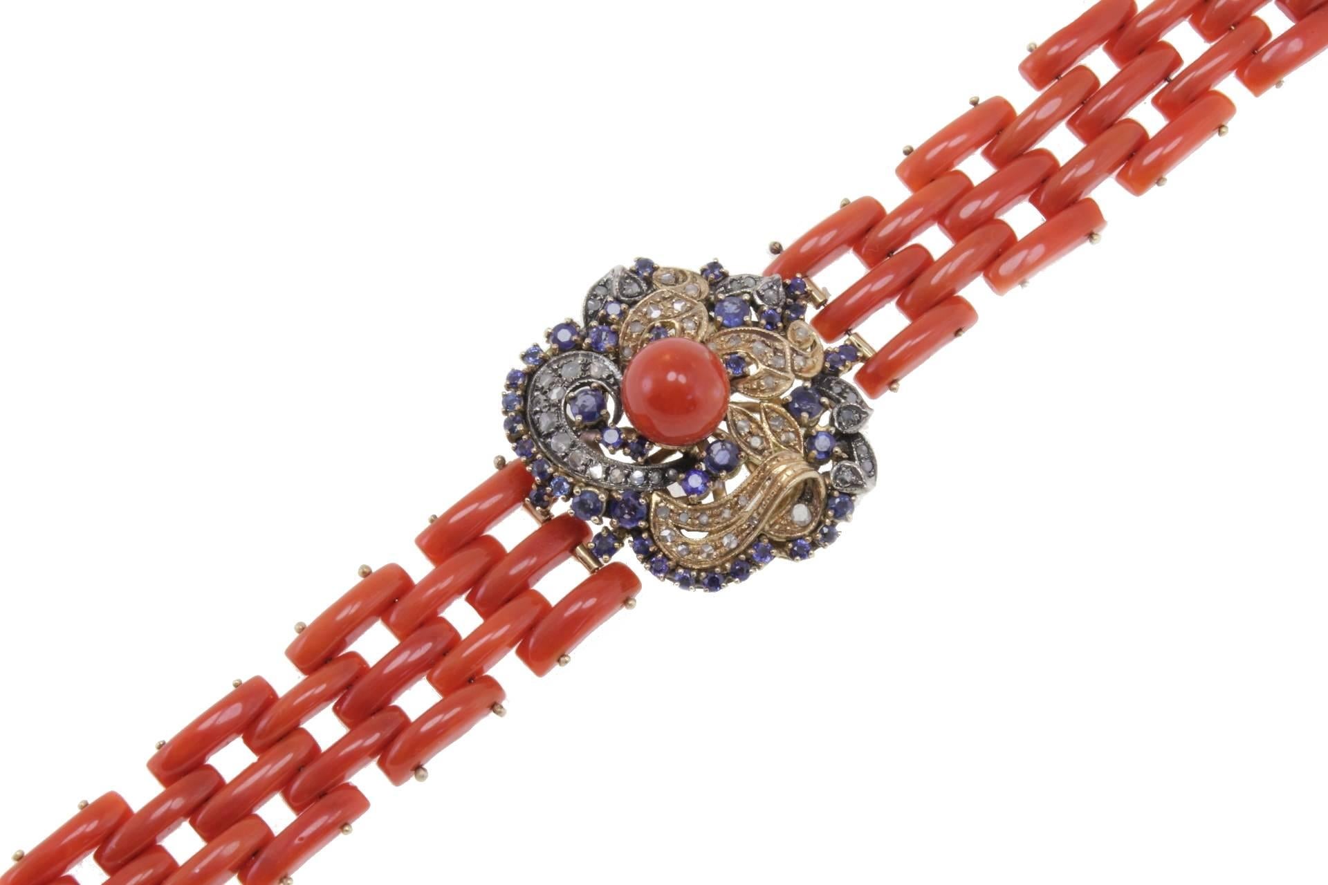 14kt yellow gold and silver coral bracelet mounted with a flower in center composed of diamonds blue sapphires and coral pearls.
Diamonds 0.57 kt
Blue Sapphires 3.82 kt
Coral 13.20 gr
Tot.Weight 41.40 gr
R.F ogfg