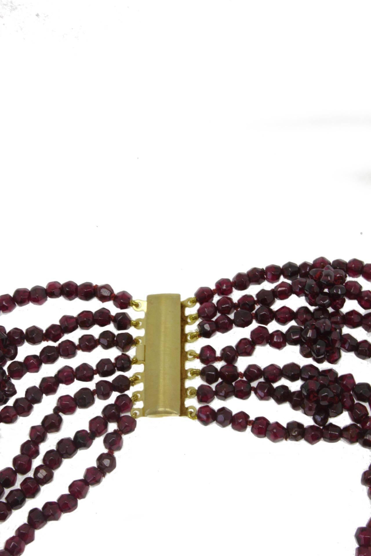 Multi-strands necklace composed of seven garnets rows and silver clasp.
Garnets 309.00 gr 
Tot.Weight 312.70 gr
R.F oic