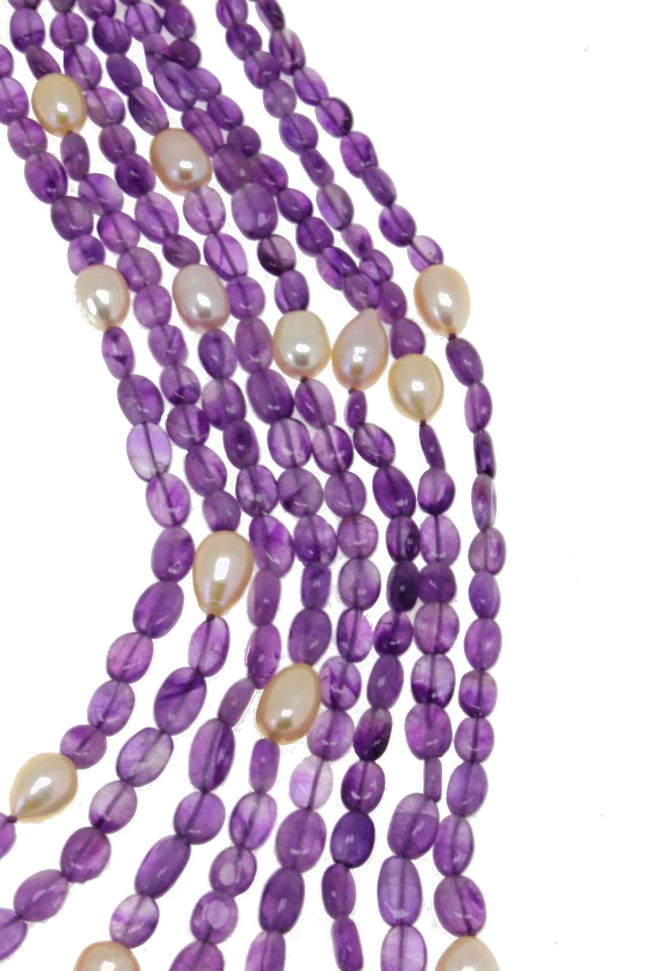 Multi-Strands necklace composed of 8 amethyst/pearl rows and silver clasp.
Amethyst 805.00 kt
Pearls 54.60 gr
Tot.Weight 221.10 gr
R.F fer