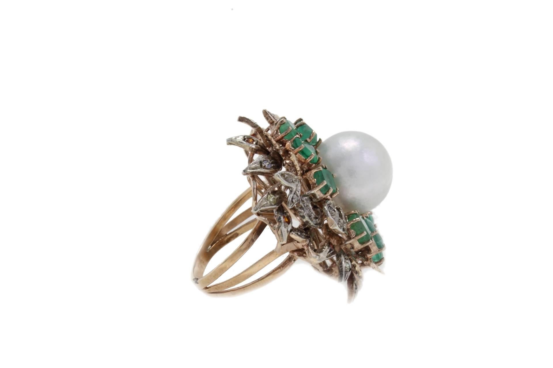 Cluster Ring in 9k gold and silver composed of a pearl in the center surrounded by diamonds, colored stones and emeralds.
Diamonds 0.22 kt
Emeralds 3.29 kt
Colored Stones 0.09 kt
Pearl 3.10 gr
Tot.Weight 14.10 gr
R.F gfhf

For any enquires, please
