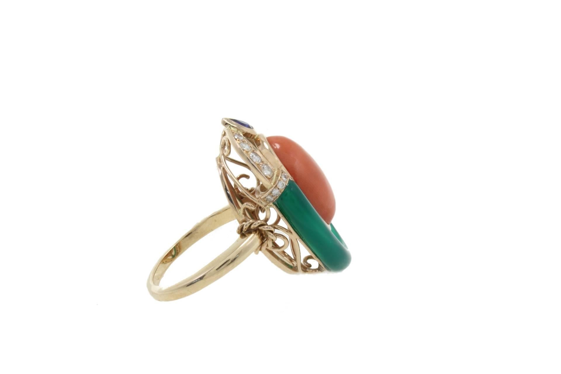 Cocktail ring in 14k rose gold mounted with diamonds, blue sapphire, green agate and coral.
Diamonds 0.40 kt
Blue Sapphire 0.27 kt
Green Agate 0.70 gr
Coral 1.80 gr
Tot.Weight 11.30 gr
R.F faao