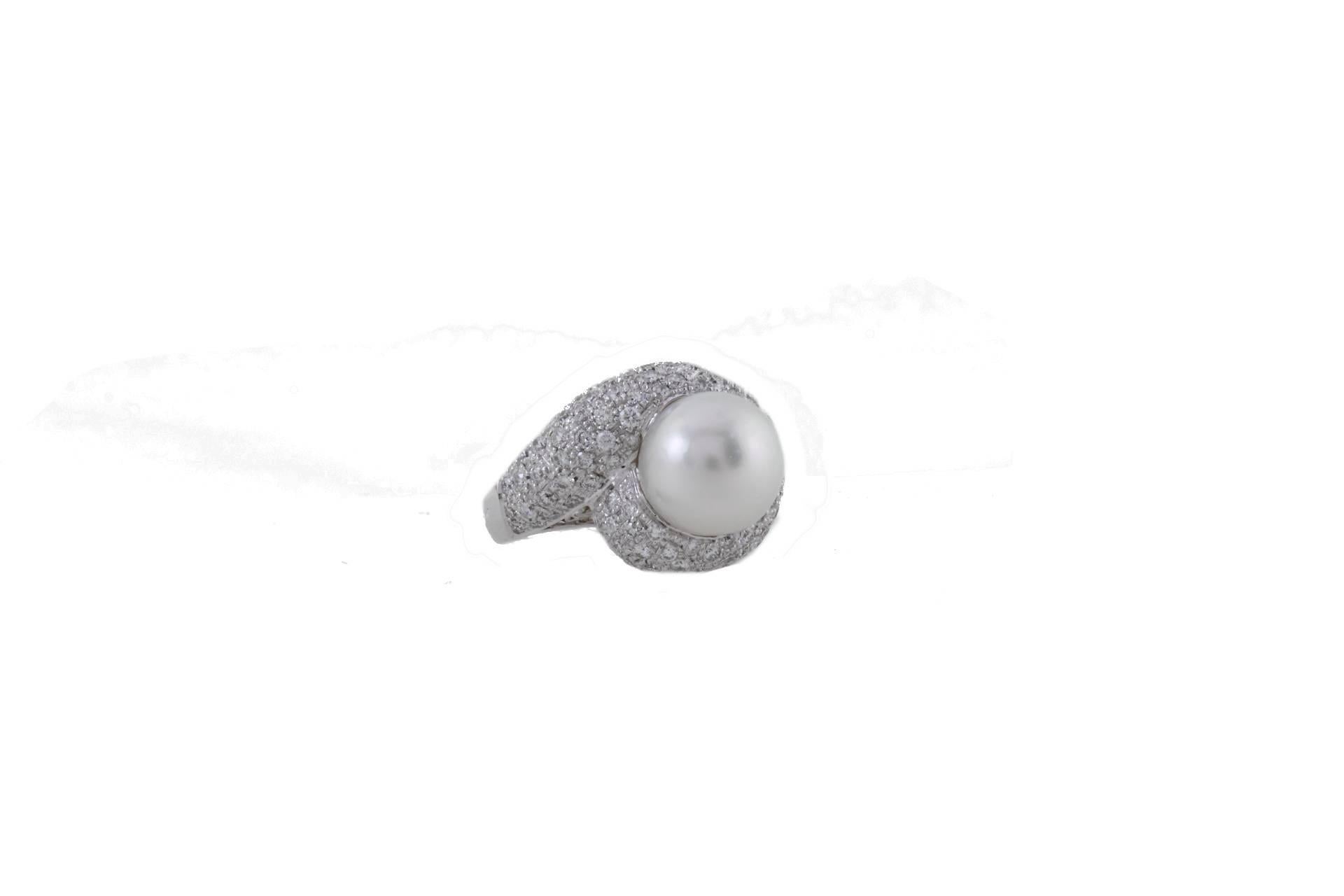 Cluster ring in 14k white gold mounted with one pearl in the center and diamonds around it.
Diamonds 2.41 kt
Pearl 1.90 gr/ 11 mm
Tot.Weight 12.10 gr 
R.F   +CEIU
RK.ARFF
Italian Size 16
French Size 56
Usa Size 7.5
For any enquires, please contact