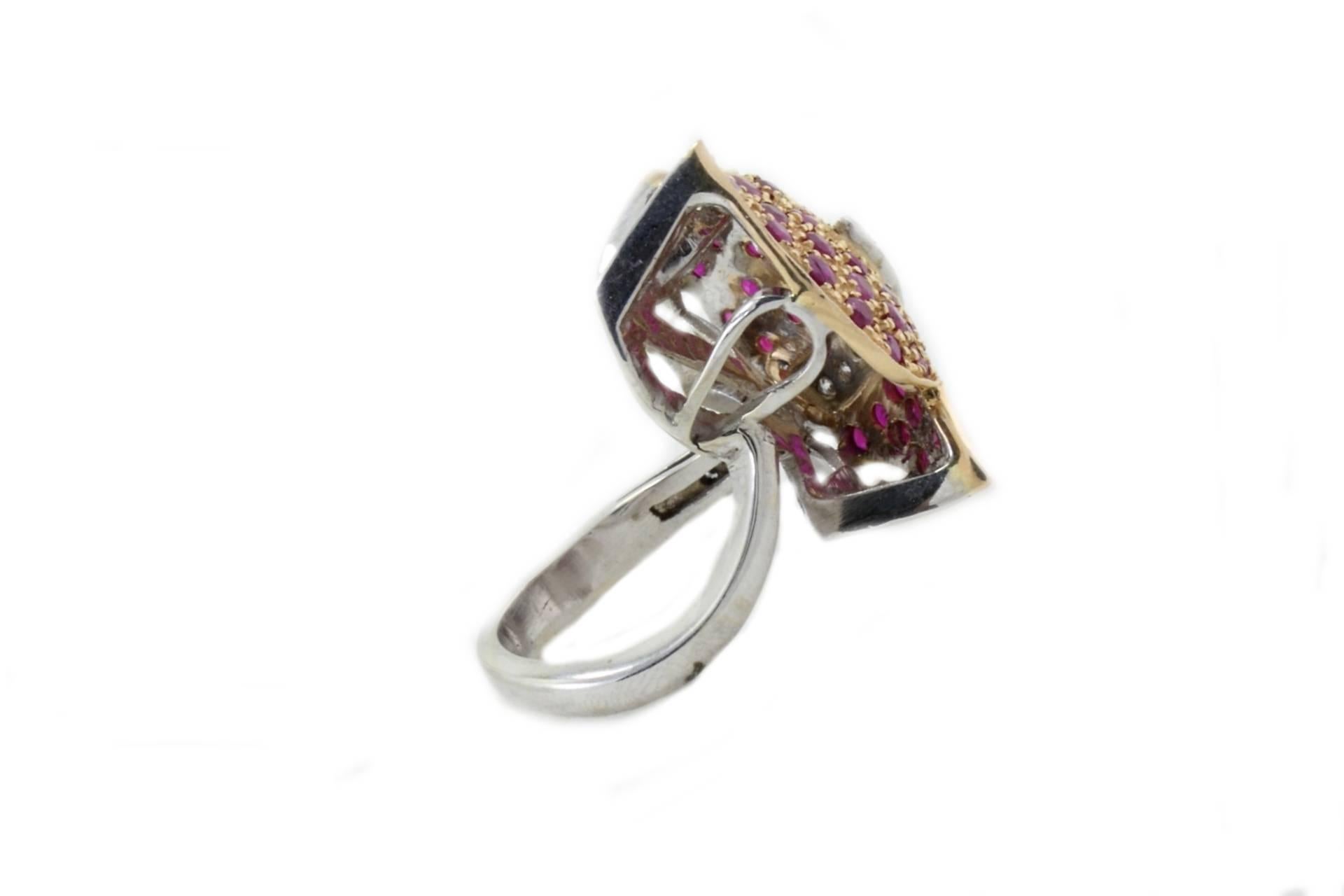 Leaf shaped ring in 14k white and yellow gold mounted with white diamonds and rubies.

Diamonds 0.24 kt
Rubies 2.68 kt
Tot.Weight 11.30 gr
R.F giho