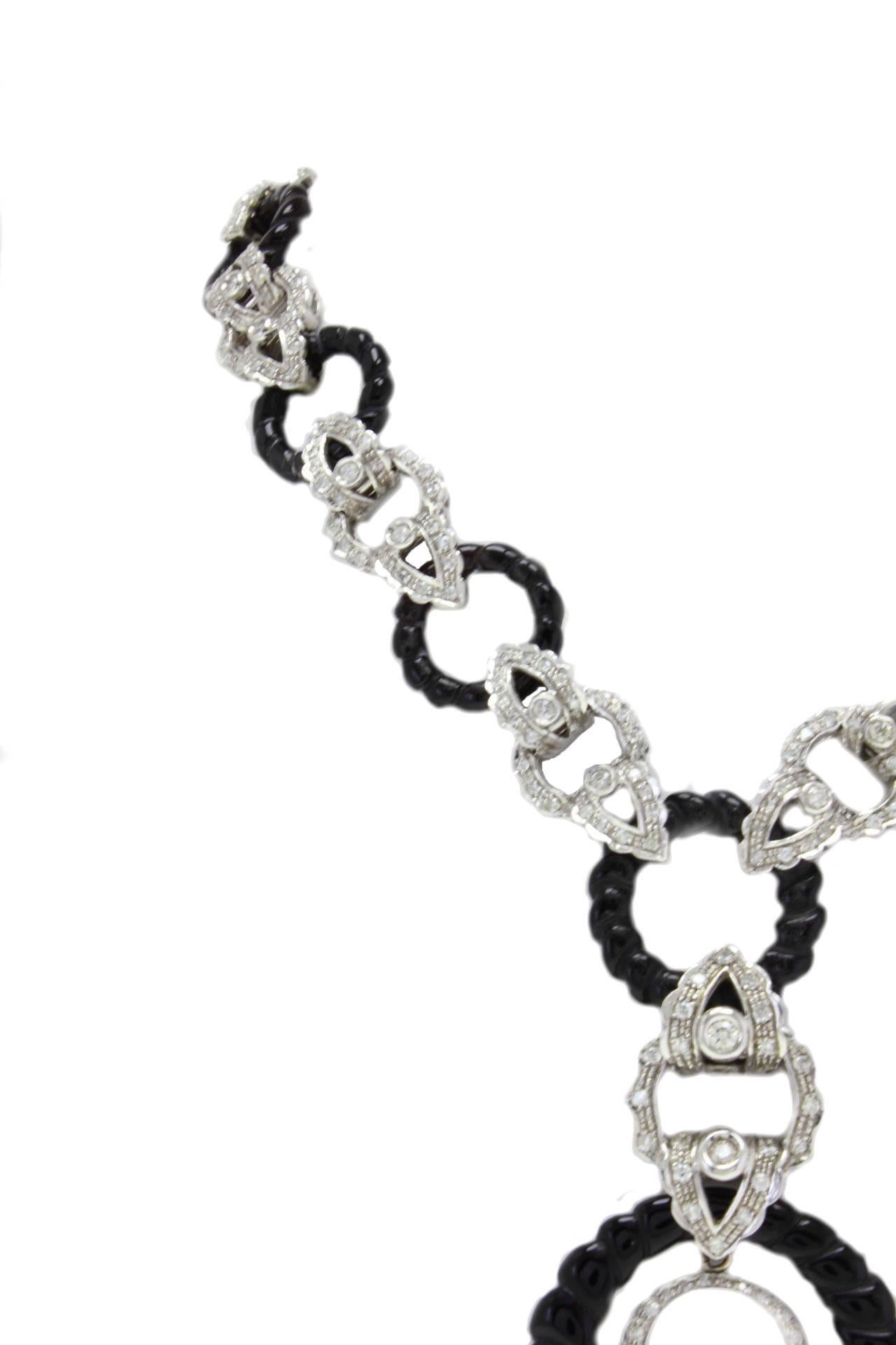 Stylish link necklace in 14 white gold with this delightful diamonds and onyx rings.

diamonds(7.48Kt) 
onyx(23.00gr) 
Tot weight 89.6gr
R.F. 8135183