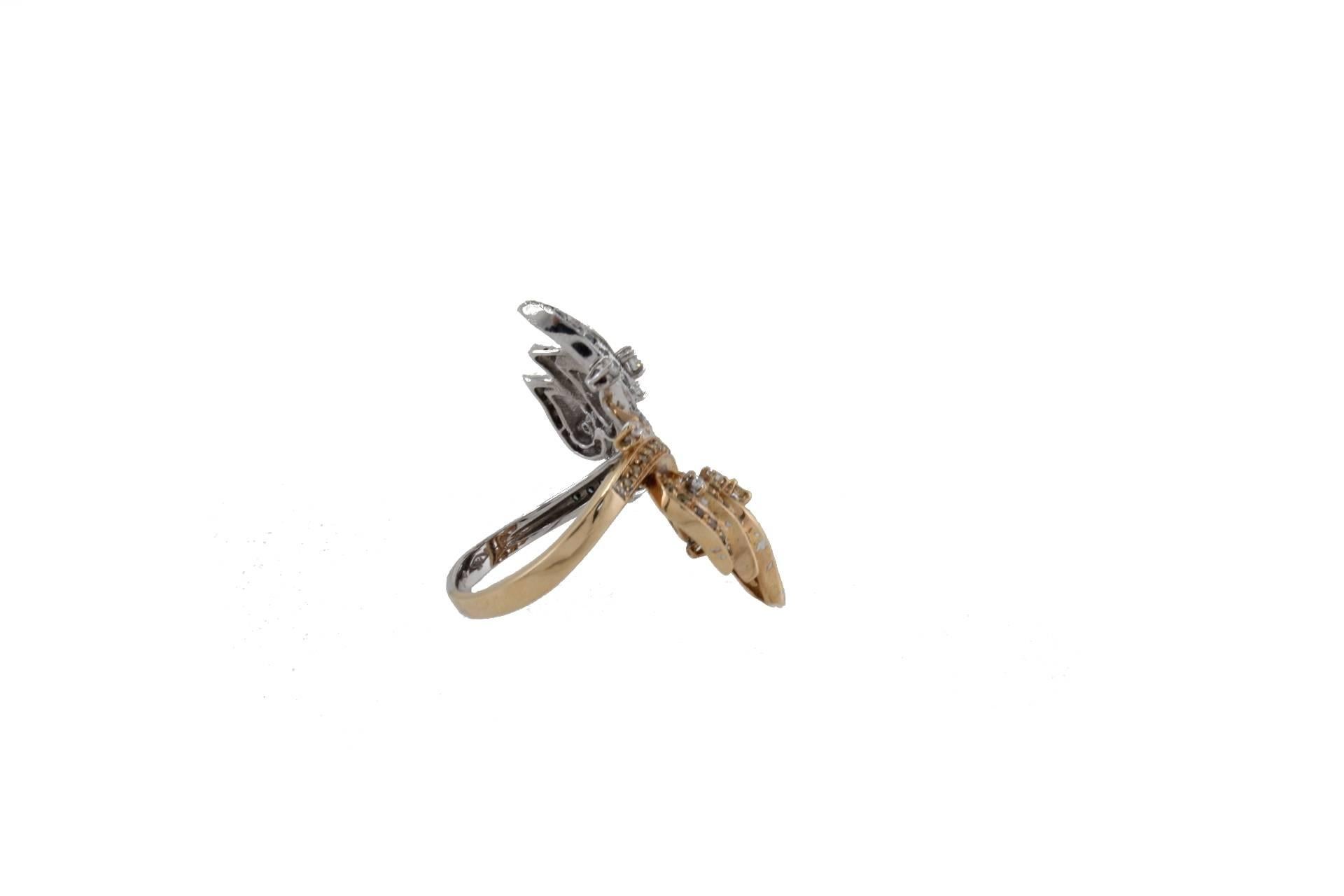 Delightful butterfly shape ring in 18kt white and rose gold structure mounted with white and fancy diamonds on the wings and body.
White and Fancy Diamonds ct 1.06
Tot Weight 9 g
R.F uhua
Diameter: 2.2 cm 
Length 3.3 cm 
Ring Size:
Italian