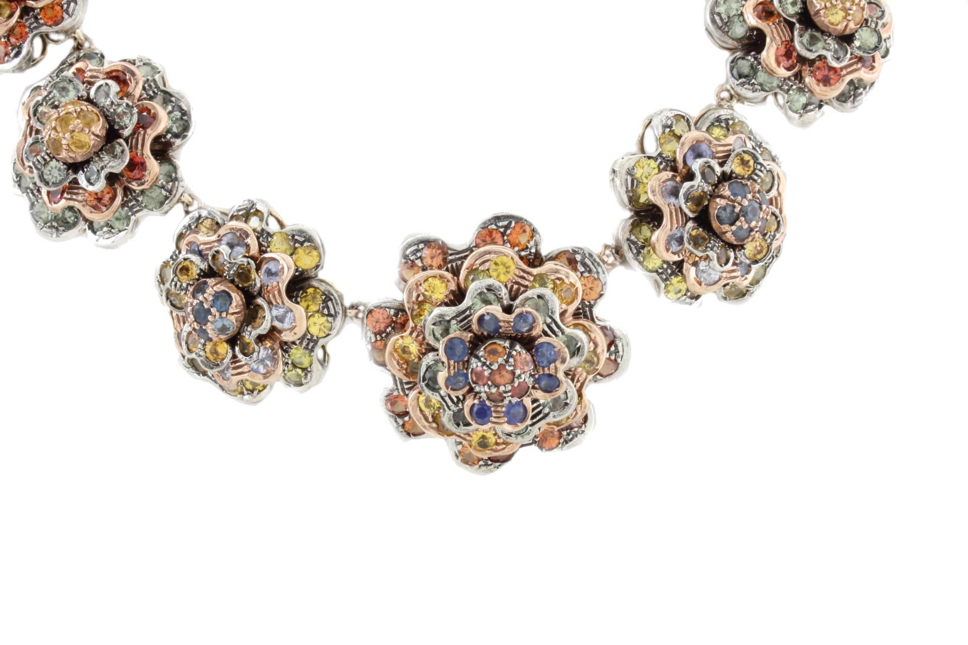 This fashion design flowers choker necklace it is mounted in 9Kt rose gold and silver. All the flowers are composed of multi colored sapphires (77.22Kt) Tot weight 156.1 gr
R.f 962541

For any enquires, please contact the seller through the message