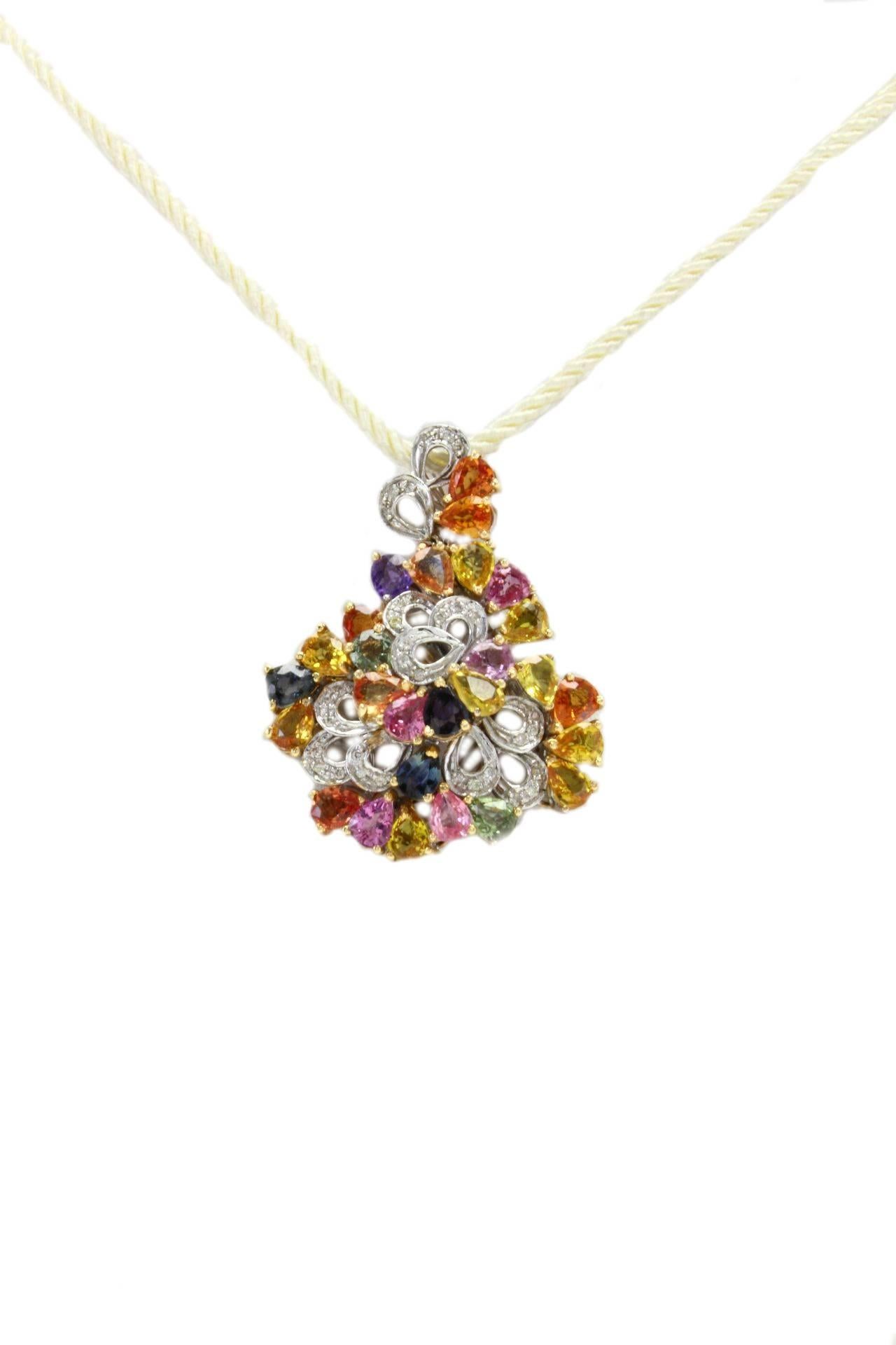 Colorful pendant in 14kt white and yellow gold with diamonds and multicolor sapphires.

Diamonds 0.33 kt
Sapphires 13.16kt
tot weight 11.40gr
c.r. ugfa 

We hereby inform our customers that in the case of return they will not charge any cost about