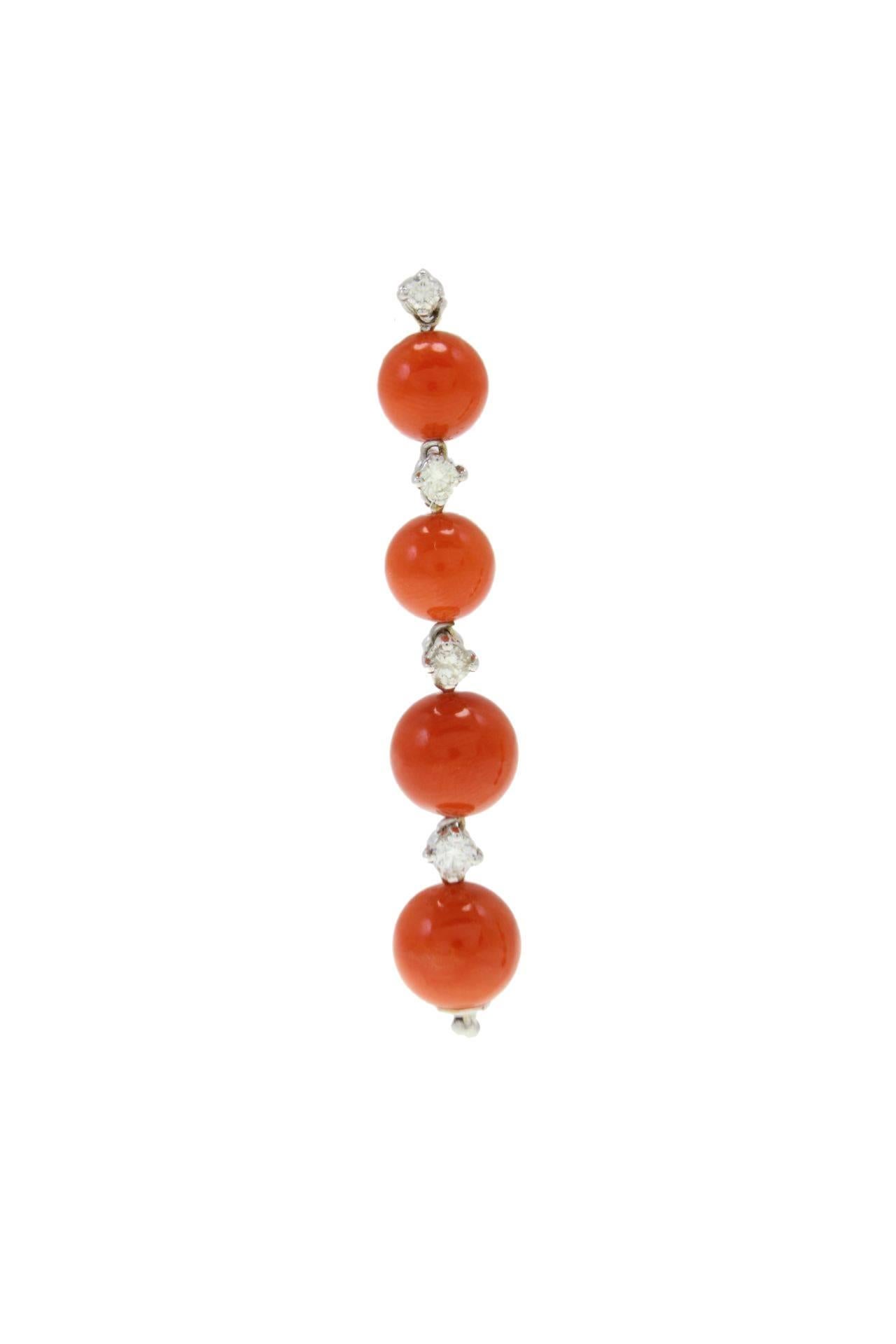 Diamonds and coral spheres are alternating to create these harmonious dangle earrings. All are set on 14Kt white gold.

Diamonds 0.52Kt
Coral 5.20 gr
Tot weight 7.4 gr

R.f. ucfc