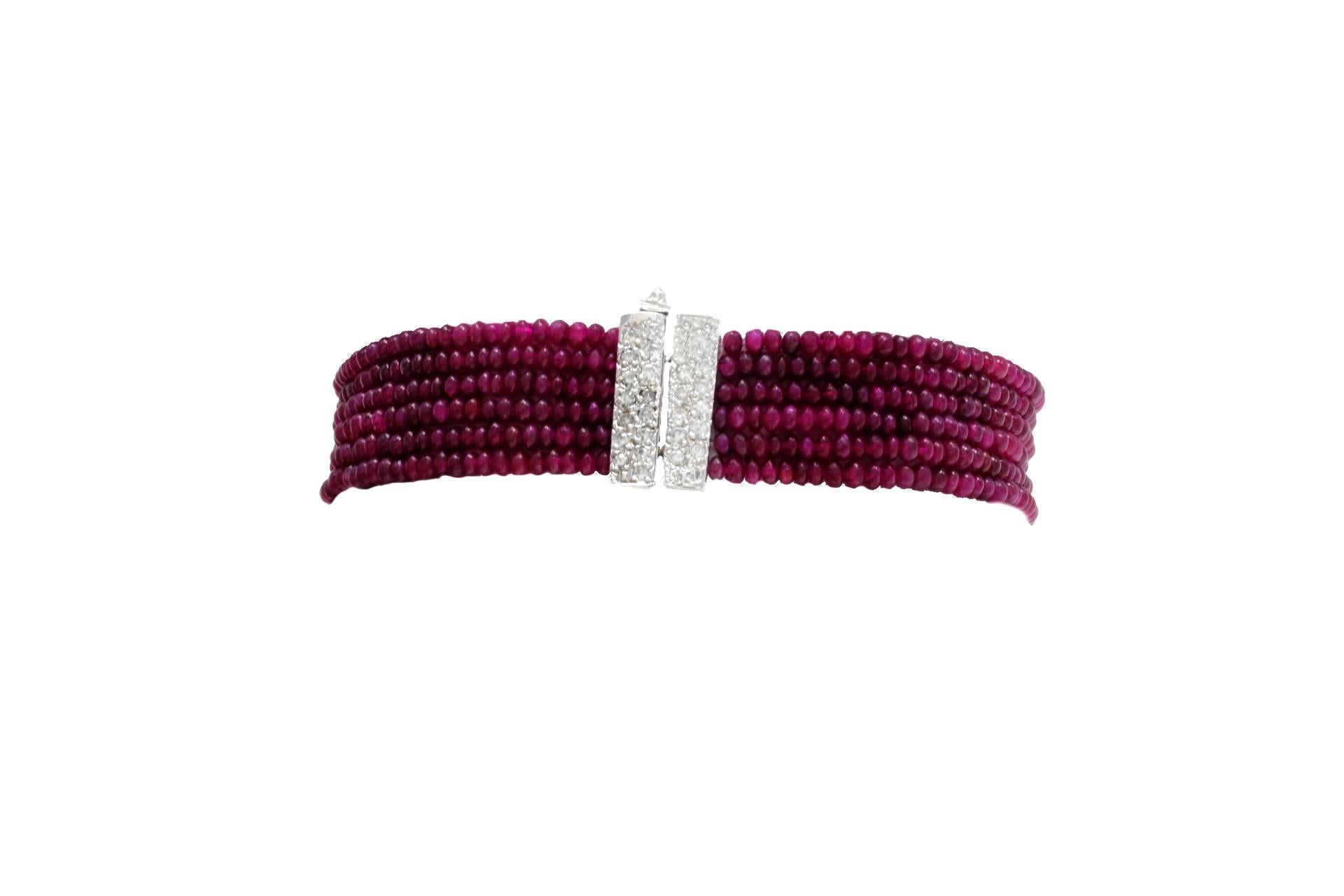 




Elegant bracelet in 14kt white gold composed of six rows of rubies divided by two diamonds stripes. The gold clasp is covered in diamonds.
diamonds 0.94kt
rubies 64.92kt
tot weight 15.5gr
r.f.  orha

For any enquires, please contact the seller