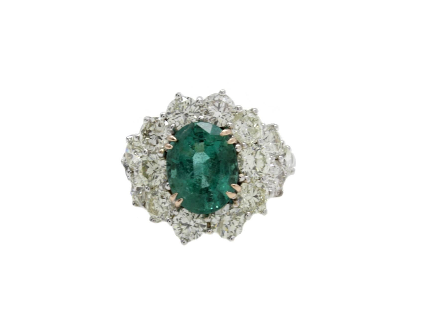 Shiny ring in 14kt white gold composed of a central emerald surrounded by a crown of diamonds.
diamonds 5.35kt
emerald 3.9kt
tot weight 8.0gr
r.f.  gereh

For any enquires, please contact the seller through the message center.