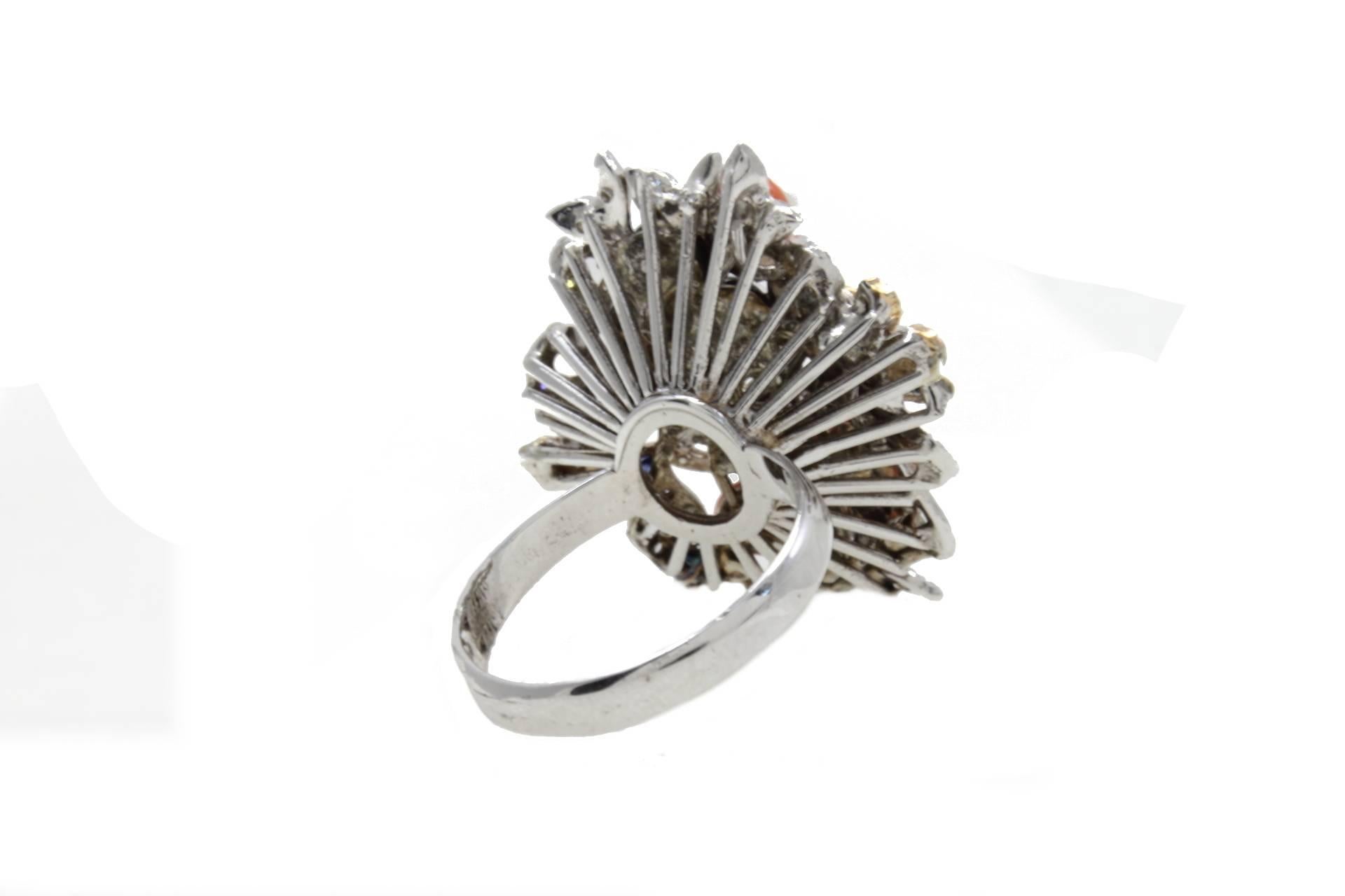 small gold flower ring with a pearl in the middle