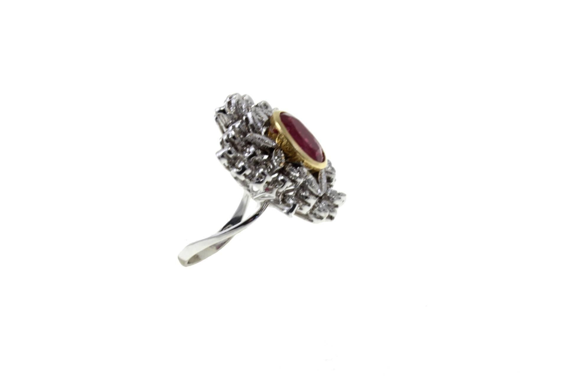 Shining ring in 14K white and rose gold composed of 6.12 ct of central ruby surrounded by 0.43 ct of diamonds encrusted leaves.
Diamonds 0.43kt
Ruby 6.12kt
Total Weight 13.60 g
R.F + gruu
