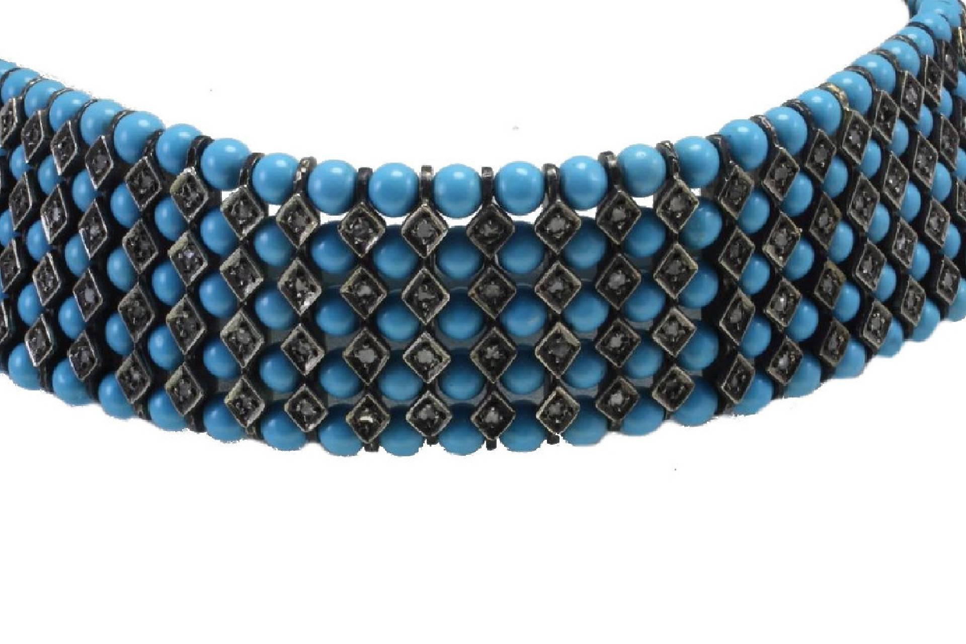 Turquoise paste choker necklace in 9kt yellow gold and silver embellished with diamonds.

diamonds 2.95kt
tot weight 95.2gr
r.f.  goee