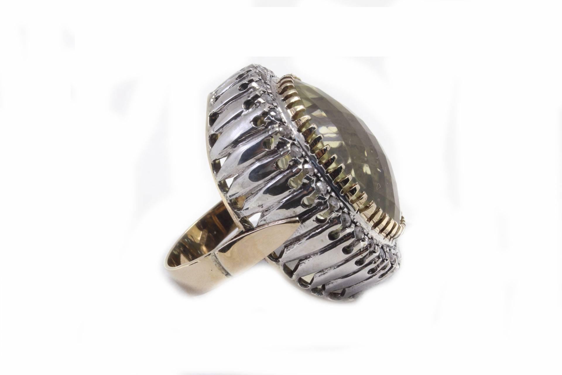 Shiny ring in 9kt  rose gold and silver composed of a central light lemon citrine surrounded by a diamonds oval stripe.
Ring Size: ITA 16 - French 56 - US 7.5 - UK P
Tot Weight 18.1 g
Diamonds 1.23 Kt
Citrin 31.00 Kt

Rf. geri