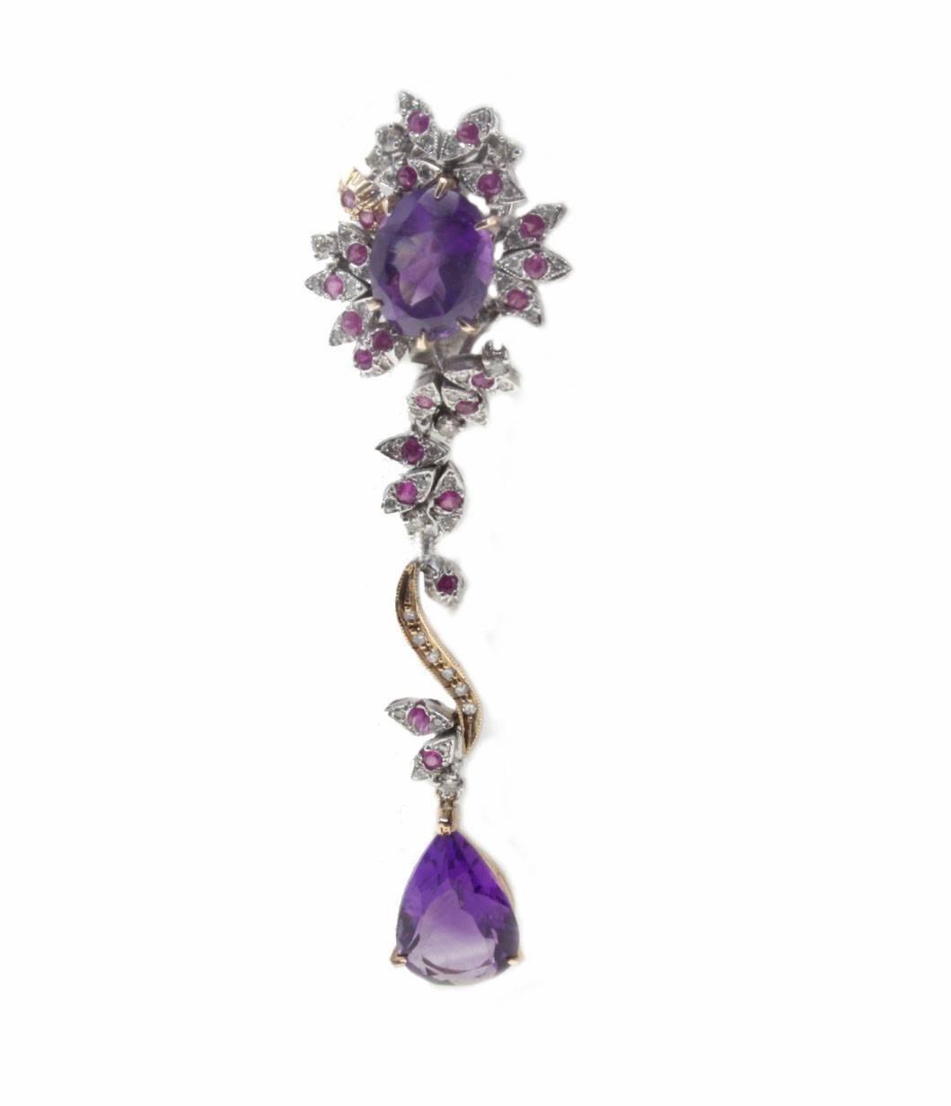 Charming dangle earrings mounted in 14Kt rose gold and 14Kt white gold.On top of it there is an amethyst surrounded of diamonds and rubies, a 