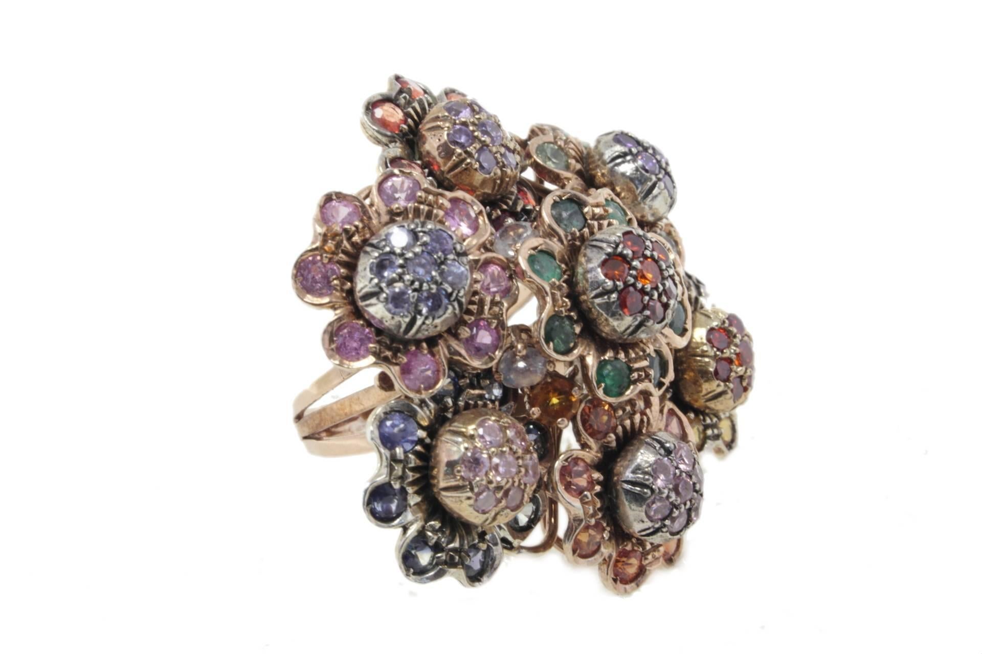 This delightful ring is a bouquet of gemstones, like emeralds, bloue sapphires, tourmaline and stone. All is mounted in 9Kt rose gold and silver.
Ring Size ITA 14 - French 54 - US 6.5 - UK N
Tot weight 25 gr
Emeralds, blue sapphires 5.02