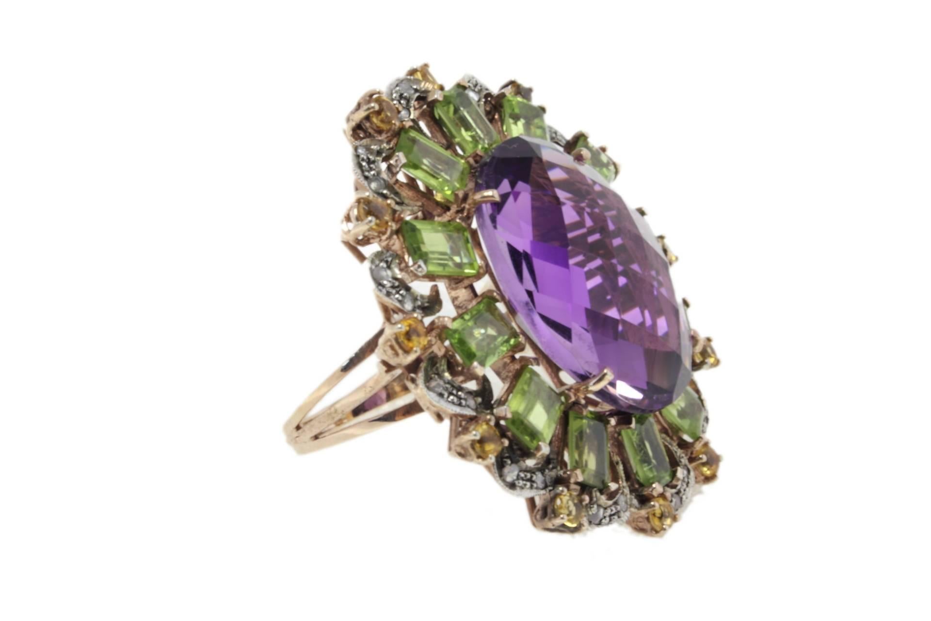 Charming and shiny oval amethyst surrounded of peridots and topazes. All these sparkling gemstones are mounted on a 9 K rose gols and silver ring.
Ring Size . ITA 22 - French 62 - US 10 - UK T-1/2

Tot weight 19 gr
Amethyst 4.9 ct
Peridots and