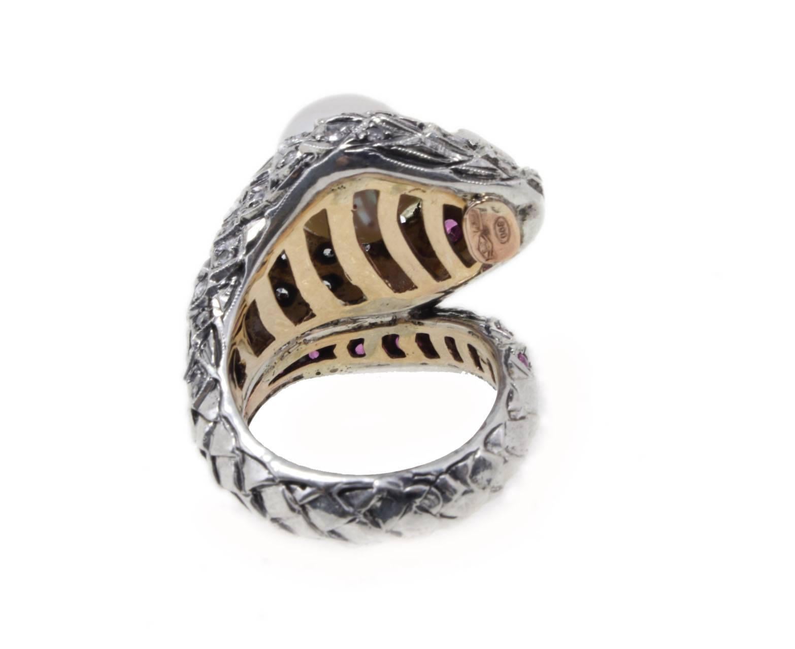 shipping policy: 
No additional costs will be added to this order.
Shipping costs will be totally covered by the seller (customs duties included). 


Sparkling and graceful cocktail and fashion ring snake shape. All is mounted in 9Kt rose gold and