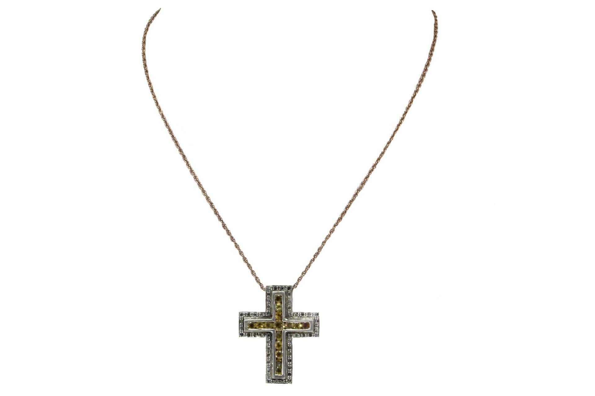 Pendant cross necklace and chain in 14kt rose gold and silver embellished with diamonds and topazes.

tot weight 11.3gr
r.f.   cge