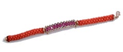 Bracelet en or rose, rubis, diamants et corail.