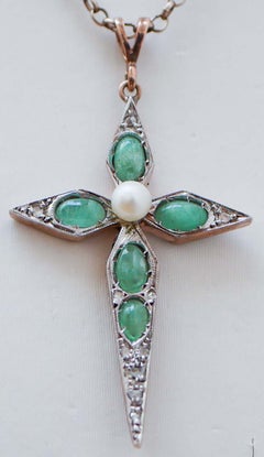 Diamonds, Emeralds, Pearl, Rose Gold and Silver Cross Pendant.