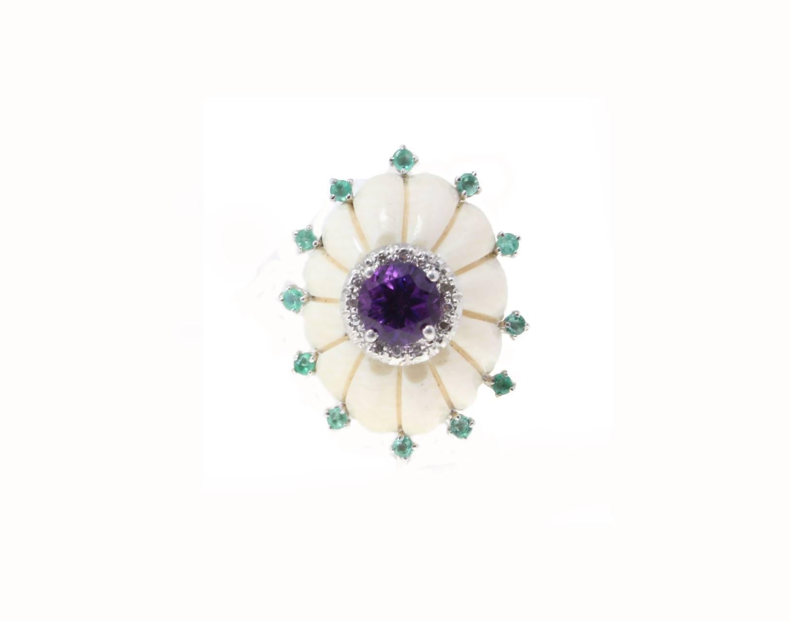 Charming stud earrings composed of a crown of emerald surrounding a central bone dome on top of it a little crown of diamonds and a hydrothermal amethyst, all is settled in  14K white gold .
Tot weight both earrings 15 g, single one 7.5 g
Diamonds