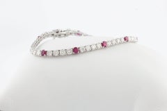 Tennisarmband aus Weißgold mit ct 5,08 Diamanten und Rubin