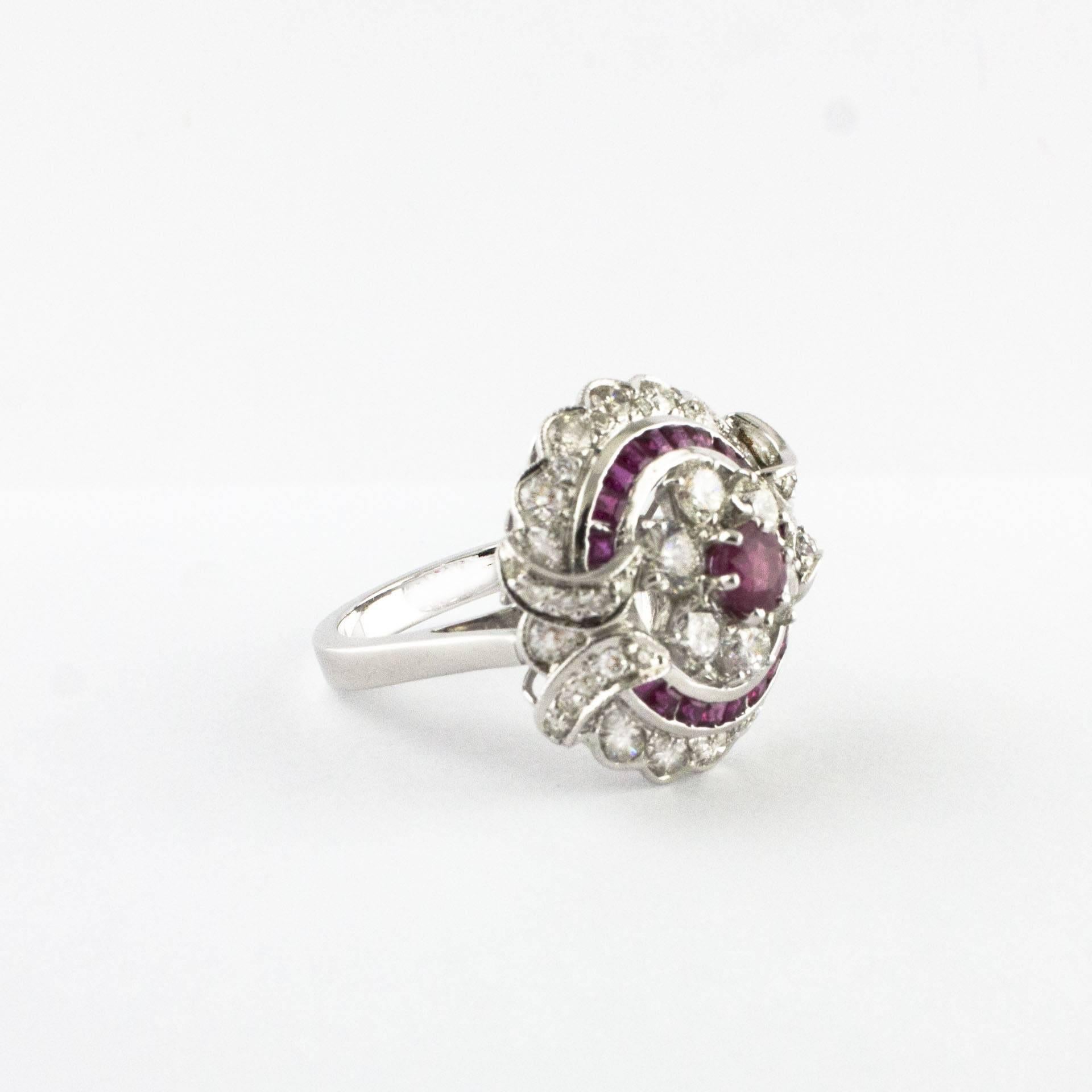 Charming Ring in 14 kt White Gold  Studded With Very Bright ct 2,80 Diamonds And Carre-Cut Rubies.
Diamonds : 2,80 ct
Rubies : 2,12 ct
Size ita : 16
Size franc : 56
Size Usa :7.50
Total weight : gr 9
R.F   +RCOA
RK.GOAG80

For any inquiries,please