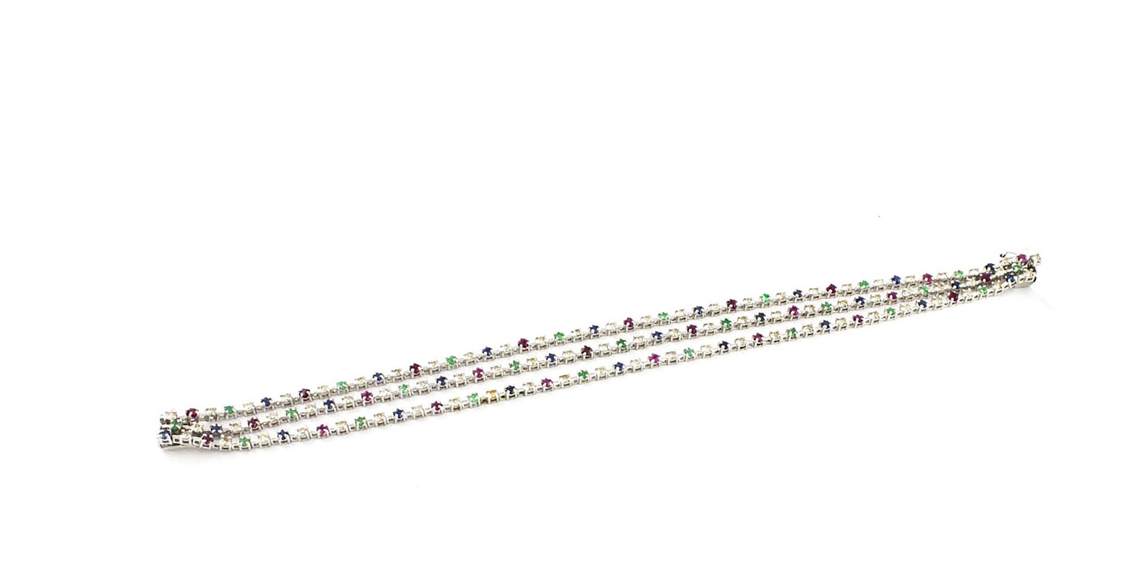 Elegant 14 kt white gold bracelet with 1.96 ct diamonds, sapphires, rubies and emeralds from ct 2.66, whose length is 18 cm and width 0.7 cm
Very special jewel for its three-wire design
Diamonds 1.96 ct
Rubies and emerald sapphires 2.66 ct
Total
