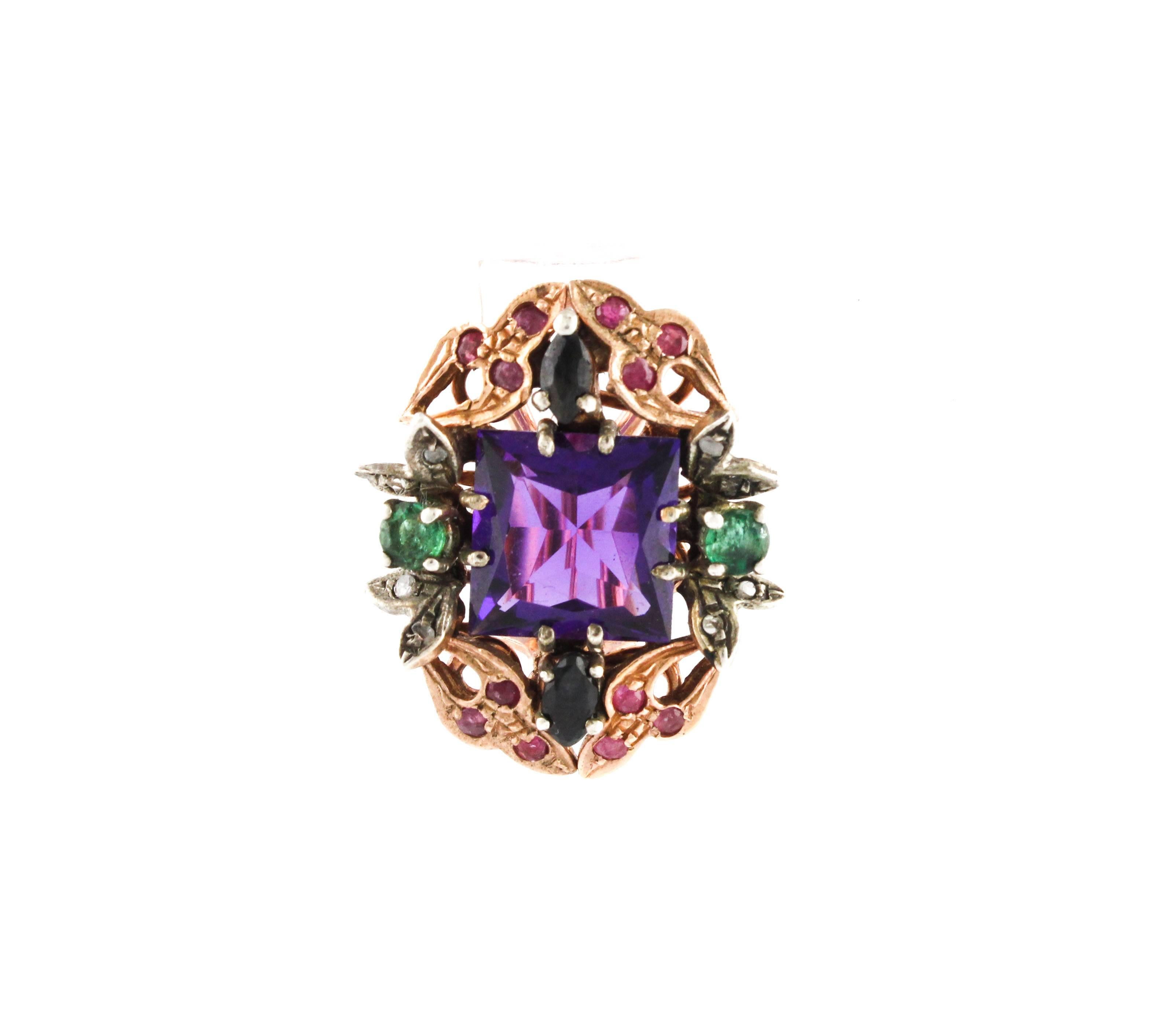 Fascinating earrings in 9kt rose gold and 10,90g silver with a spectacular amethyst centerpiece, encrusted with a sapphire, emerald,  sapphire and diamond crown.
Diamonds 0,08 ct
Ruby , Sapphires, Emeralds 2,69 ct
Ametiste 8,12 ct
Total weight 11,10