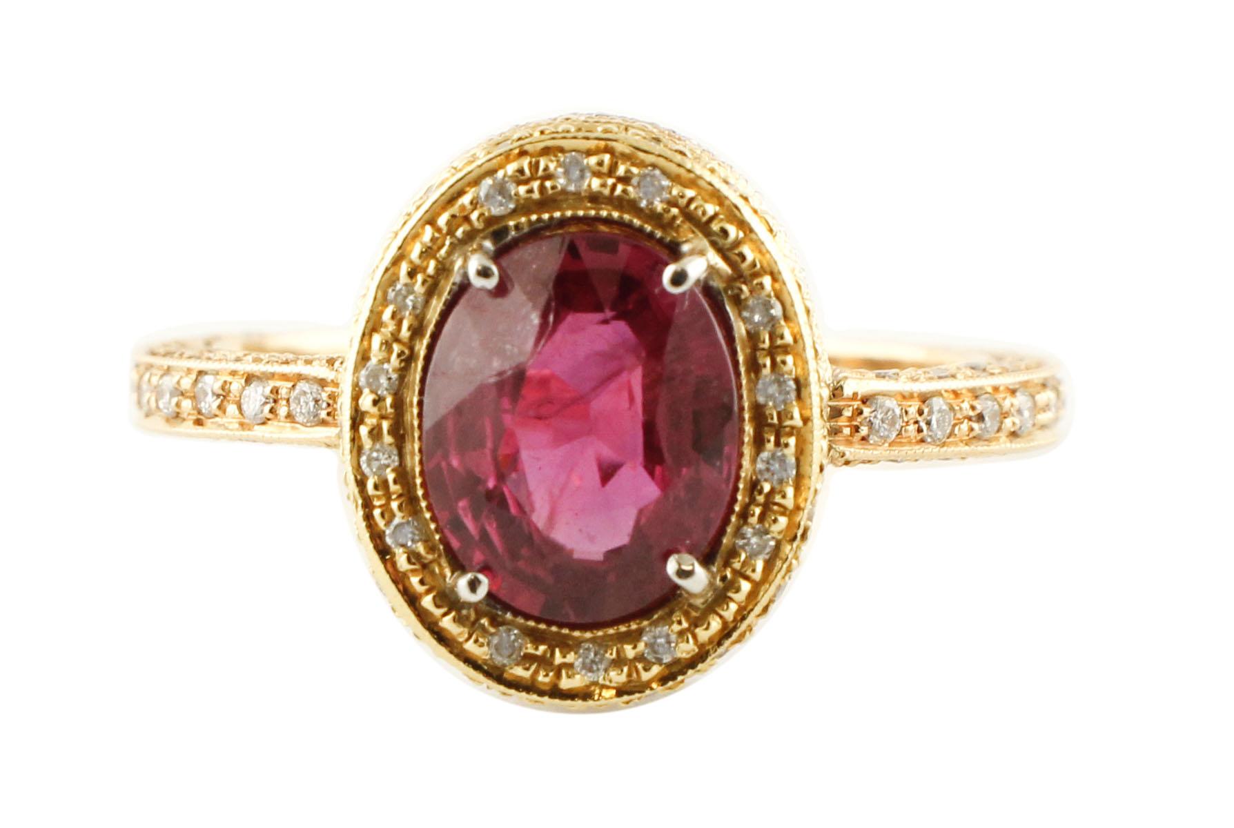 Cluster ring in 18kt yellow, rose and white gold structure, composed of 2.40 ct of a deep color ruby in the center surrounded by diamonds all around and on the two sides
Ruby 2.40 ct     (9 mm X 7 mm)
Diamonds 0.70 ct 
Total Weight 6.70 g
R.F