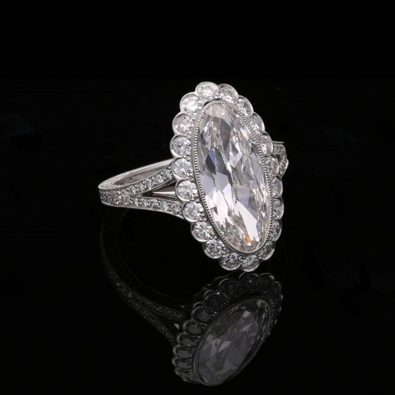 3.35 Carat Moval Diamond Ring with Scalloped Halo Surround and Split ...