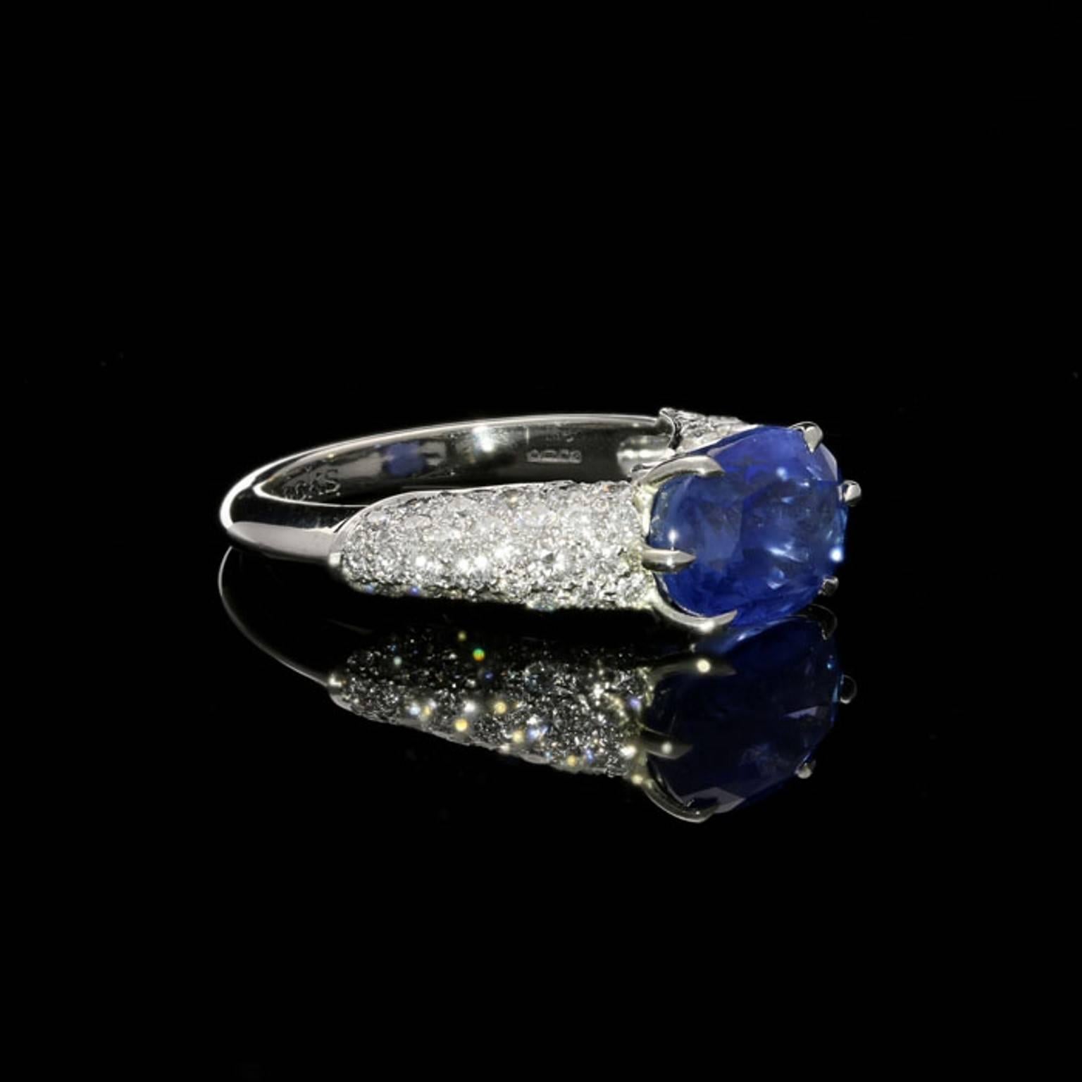 Contemporary 4.76 Carat Sapphire Ring with Pavé Diamond-Set Raised Mount in Platinum