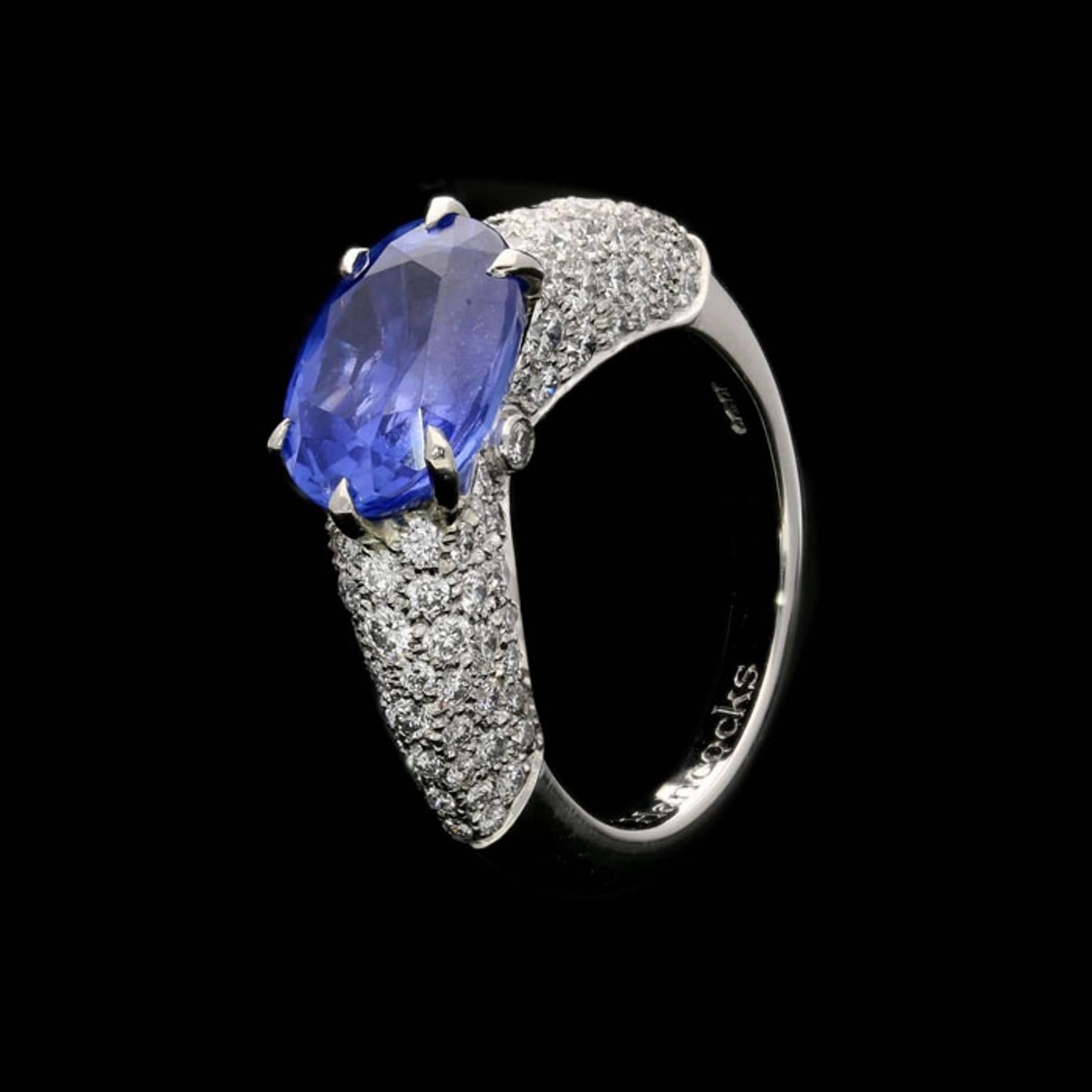Oval Cut 4.76 Carat Sapphire Ring with Pavé Diamond-Set Raised Mount in Platinum