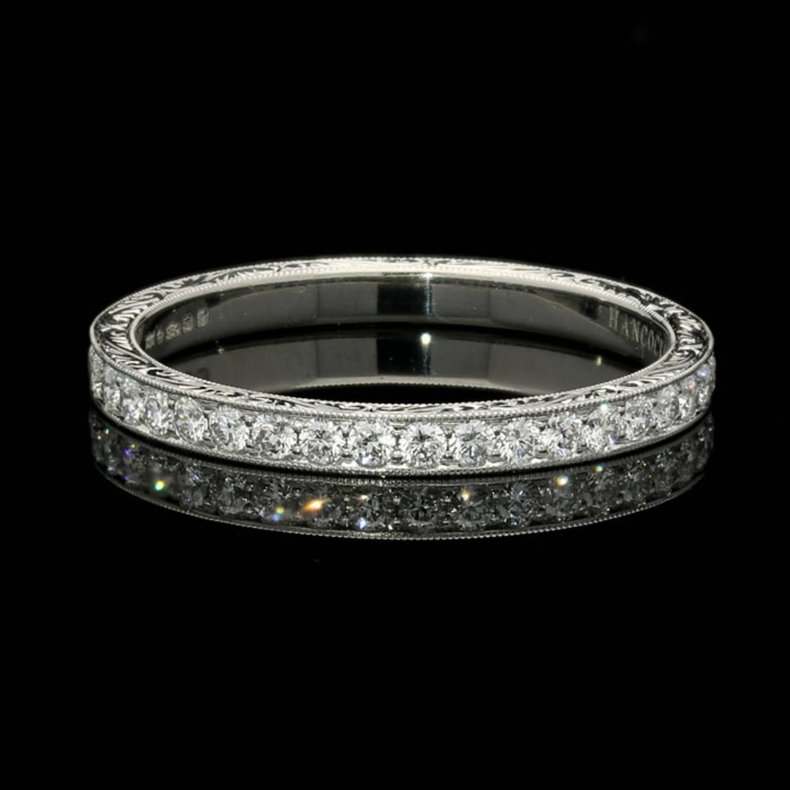 The platinum ring is set with round brilliant cut diamonds half way around the band. The exposed platinum has been ornately hand-engraved.

0.26 cts total of G VS grade round brilliant cut diamonds.

UK finger size M (Available in all