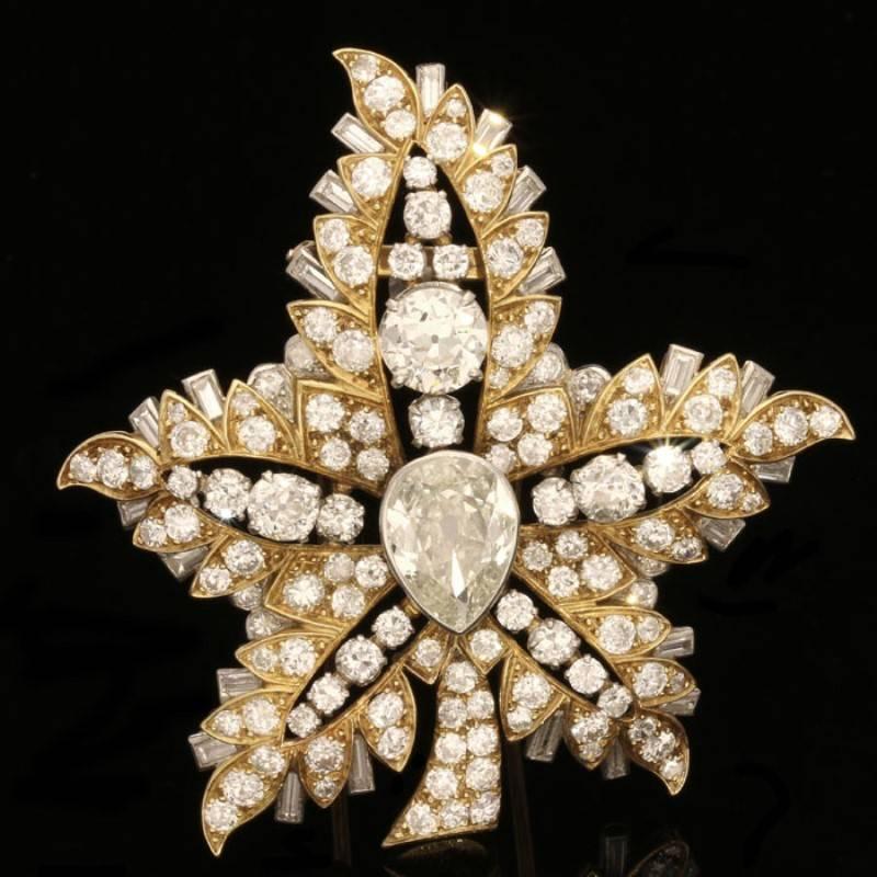 Magnificent Certified Rene Boivin Feuille de Platane Diamond Brooch
18 carat yellow gold Feuille de Platane clip brooch designed as a stylised leaf with five fronds set with a central pear-shaped cape diamond and throughout with Old-European and