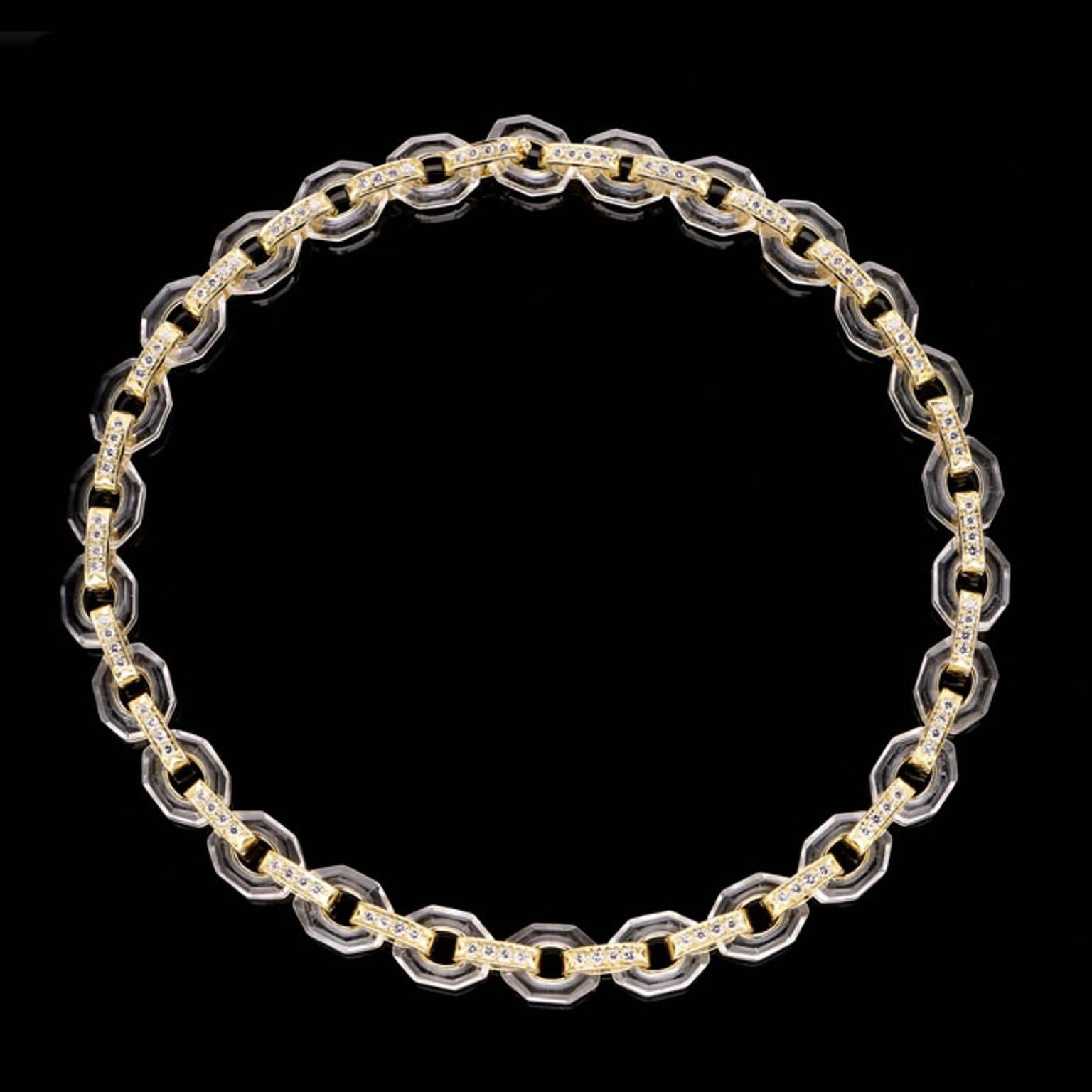 A stylish gold, diamond and rock crystal necklace by Poiray c.1980, designed as a continuous row of twenty six open octagonal-shaped rock crystal motifs joined by oval 18ct gold links set to the front with round brilliant cut diamonds, to a