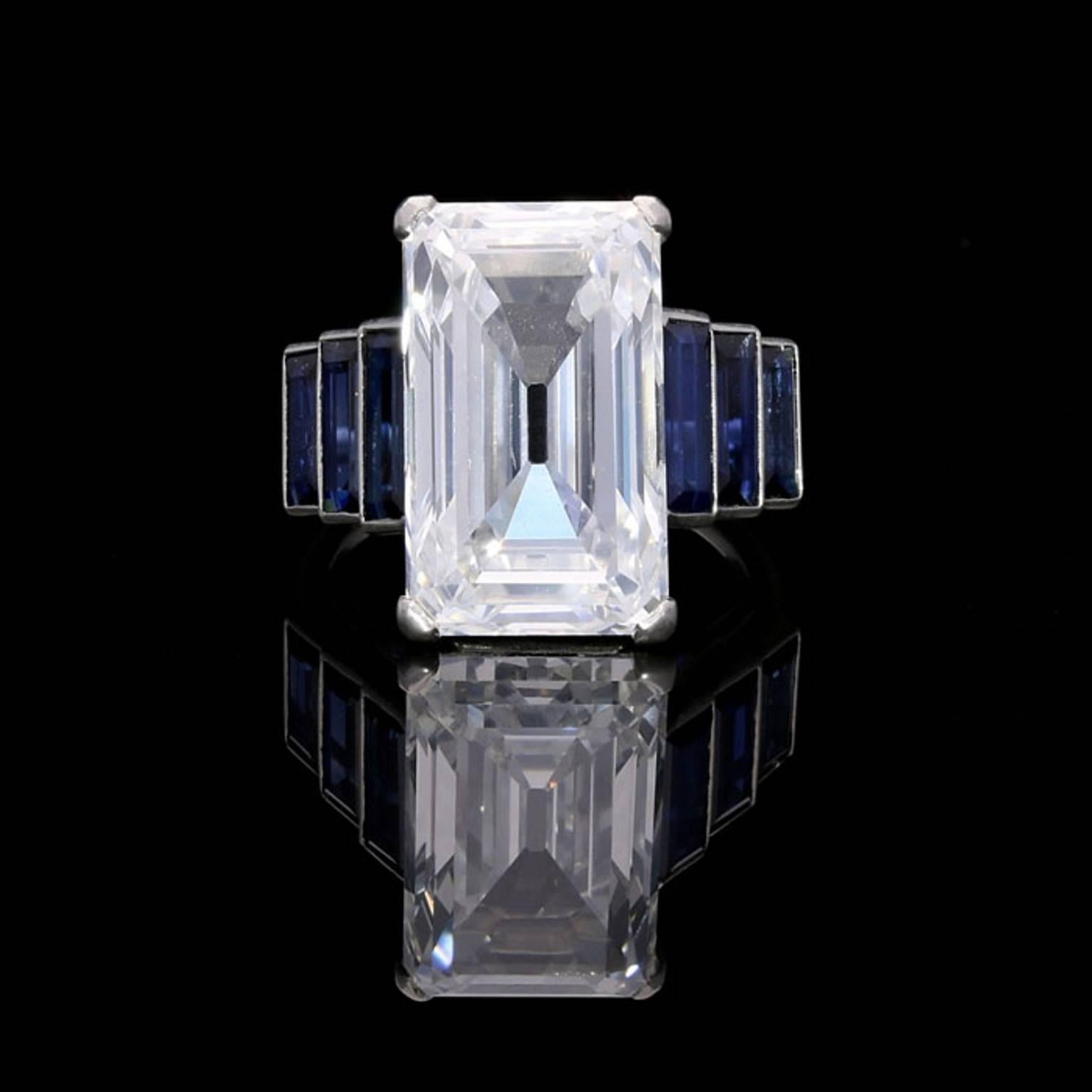 An exceptional Art Deco diamond and sapphire ring c.1920, the ring centred on a stunning emerald-cut Type IIa ‘Golconda’ diamond weighing 10.28 carat and of D colour and VS1 clarity, corner claw set between three graduated baguette-cut sapphires in